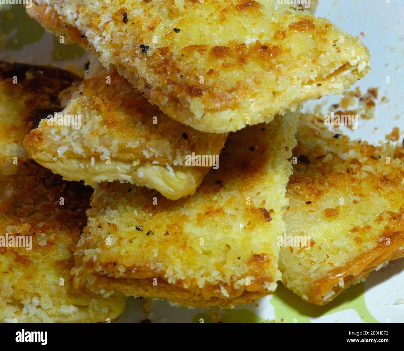 Home made deep fried Tuna Pie with bread crumbs on top in rectangular and square shapes. Stock Photo
