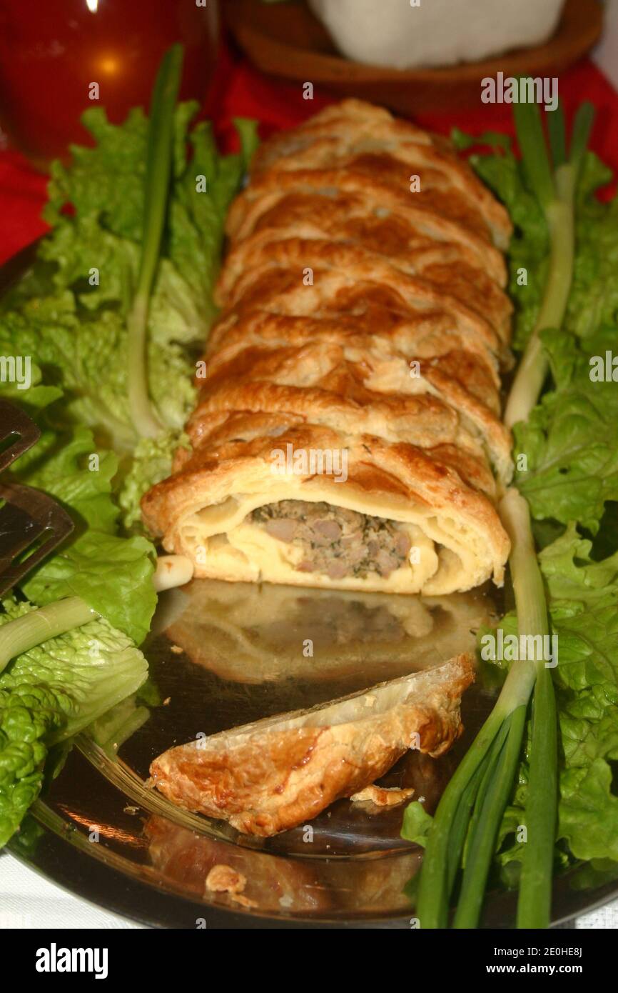 Stuffed pastry. Meat/ sausage roll. Appetizer. Stock Photo
