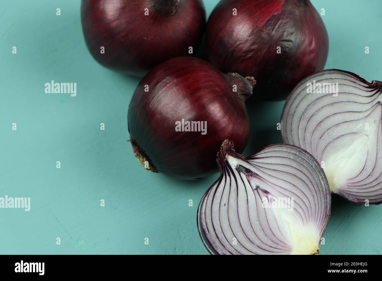 sweet red onions on background Stock Photo