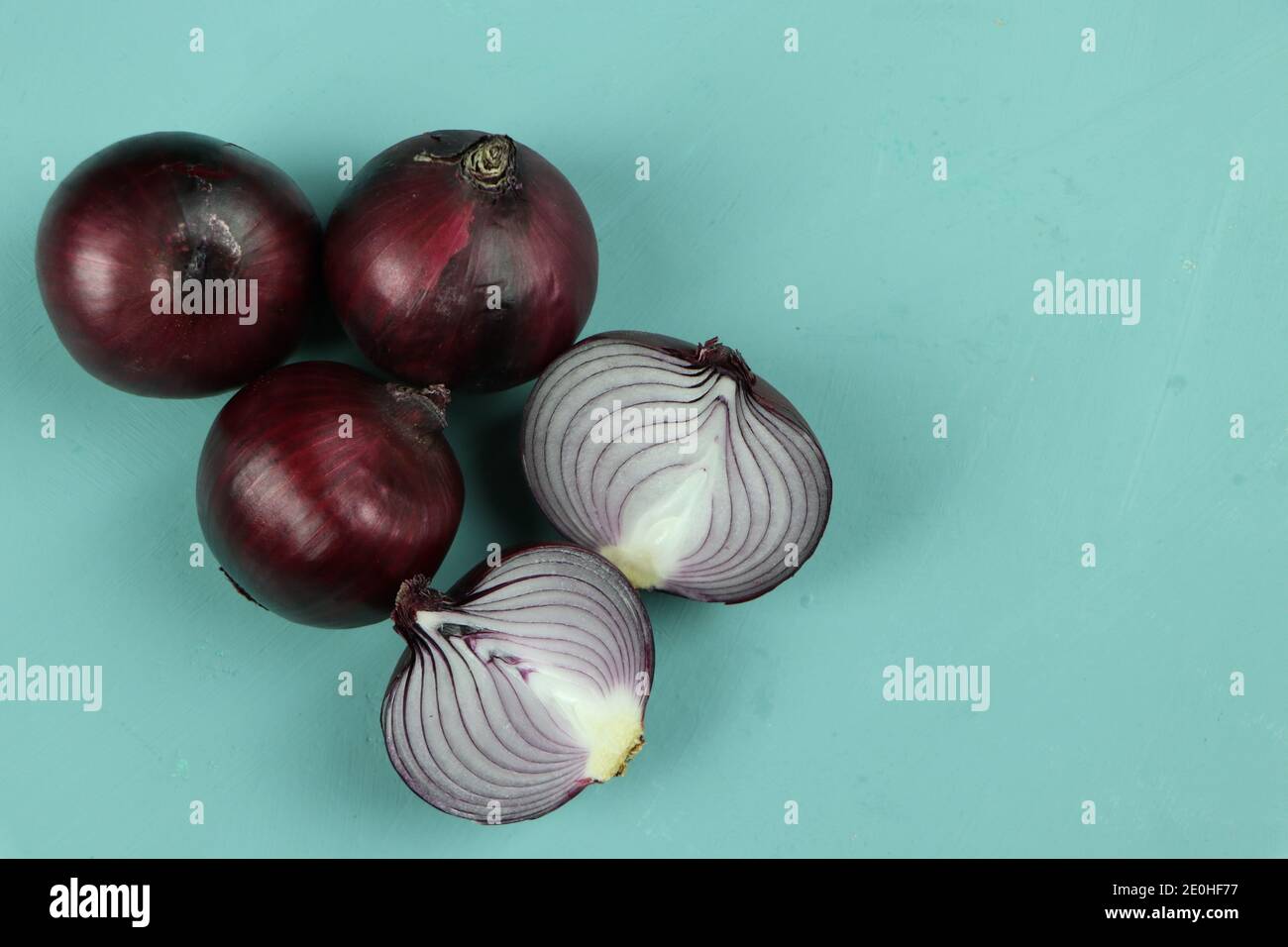 sweet red onions on background Stock Photo