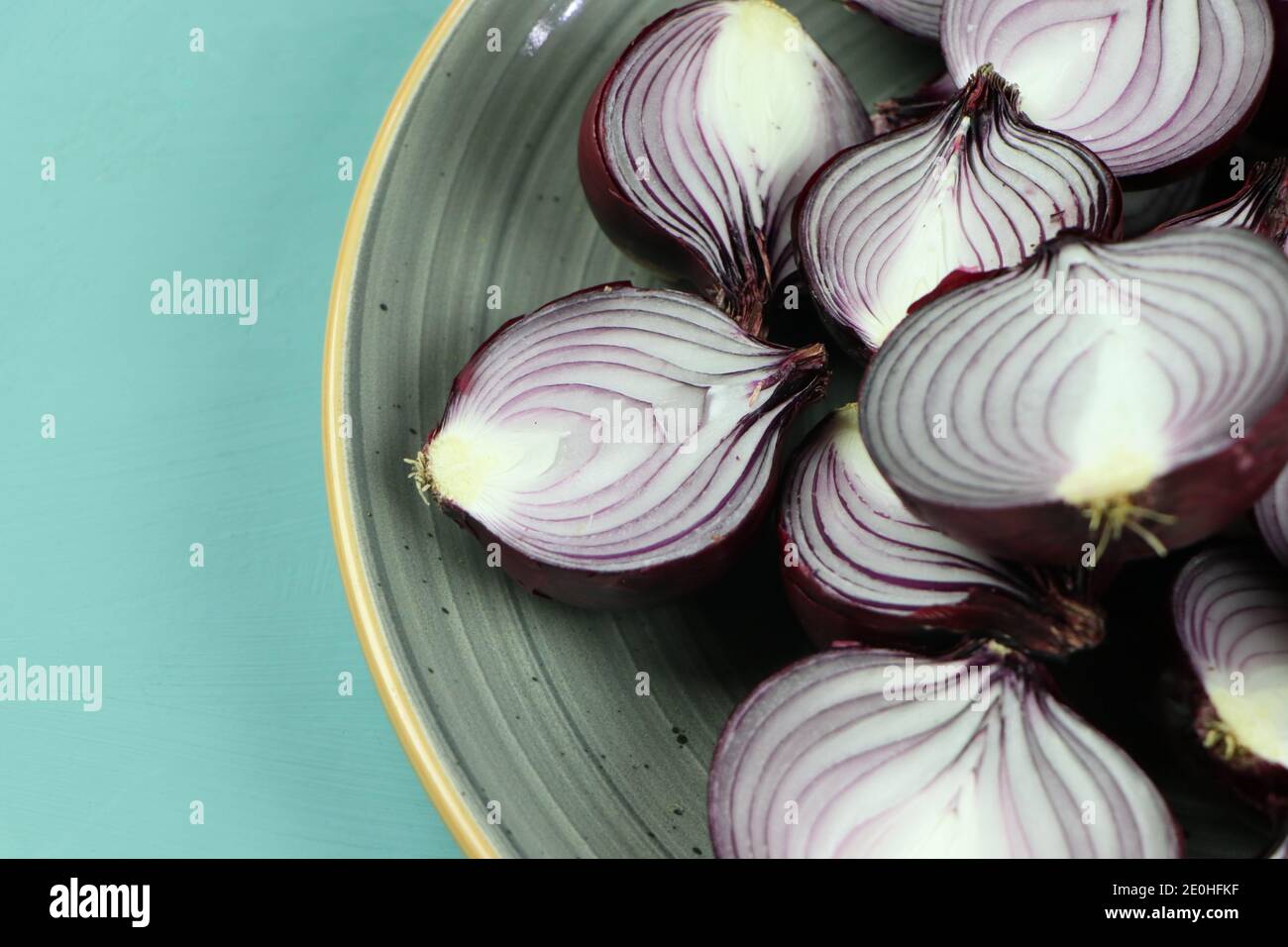 sweet red onions on background Stock Photo