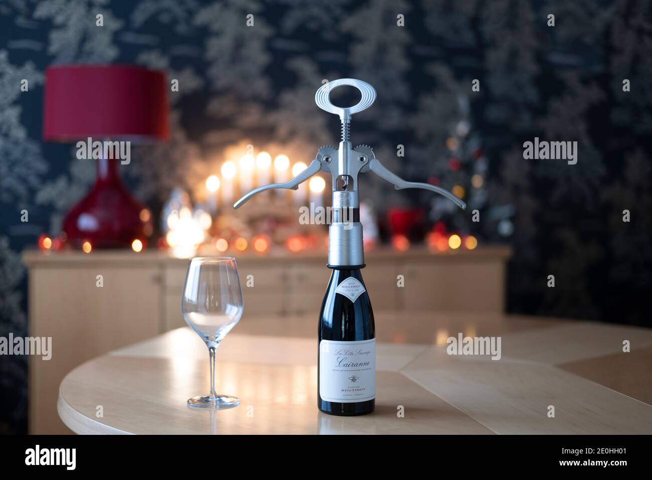 Campagnolo giant corkscrew opening a bottle of Boutinot Cote du Rhone red wine Stock Photo