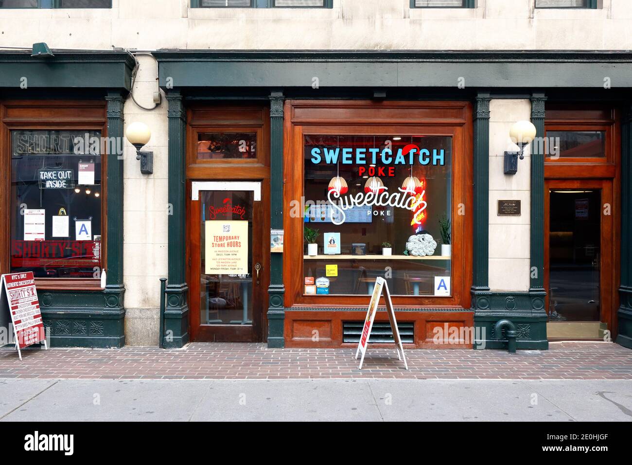 [historical storefront] Sweetcatch Poke, 66 Madison Ave, New York, NYC storefront photo of a fast casual poke bowl restaurant in Midtown Manhattan. Stock Photo