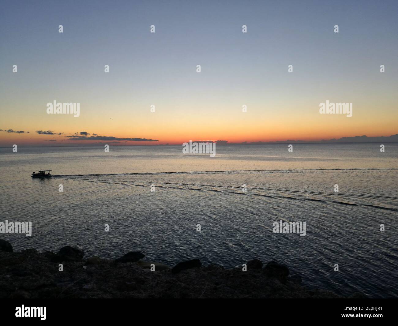 Fishing boat sailing on a rippled sea at dawn, Monemvassia, Greece Stock Photo