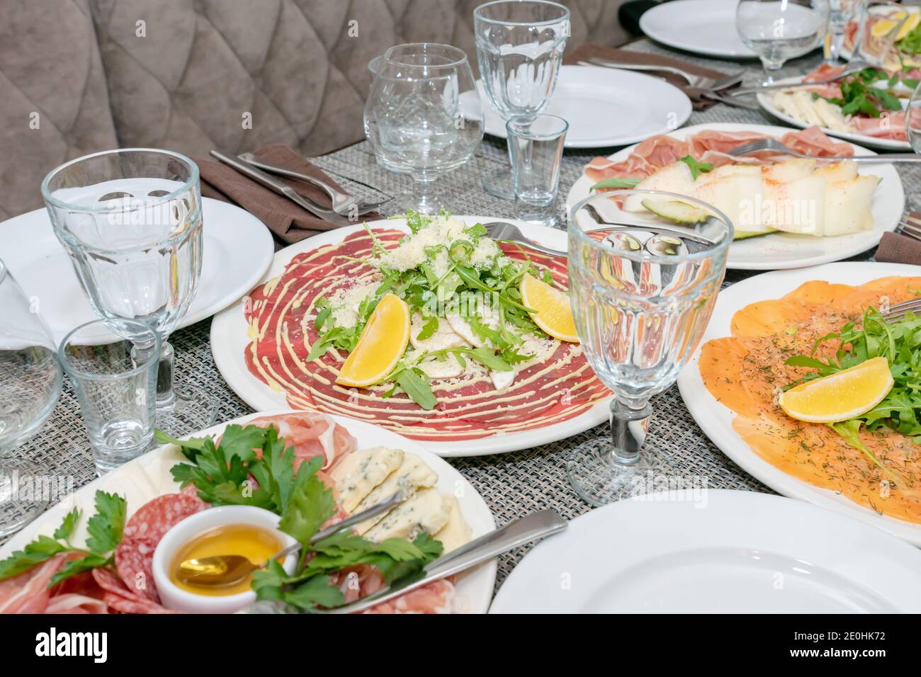 Festive Table Setting Family Dinner With Served Italian Antipasti Marinated Salmon Hamon Carpaccio Pear Basil Tablescape Stock Photo Alamy