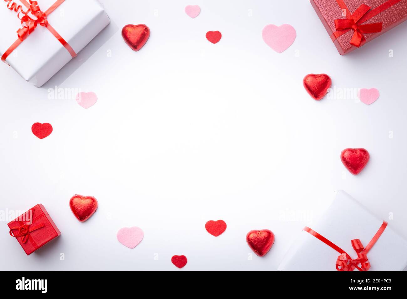 Valentine’s Day background. with gifts and hearts, in red and white