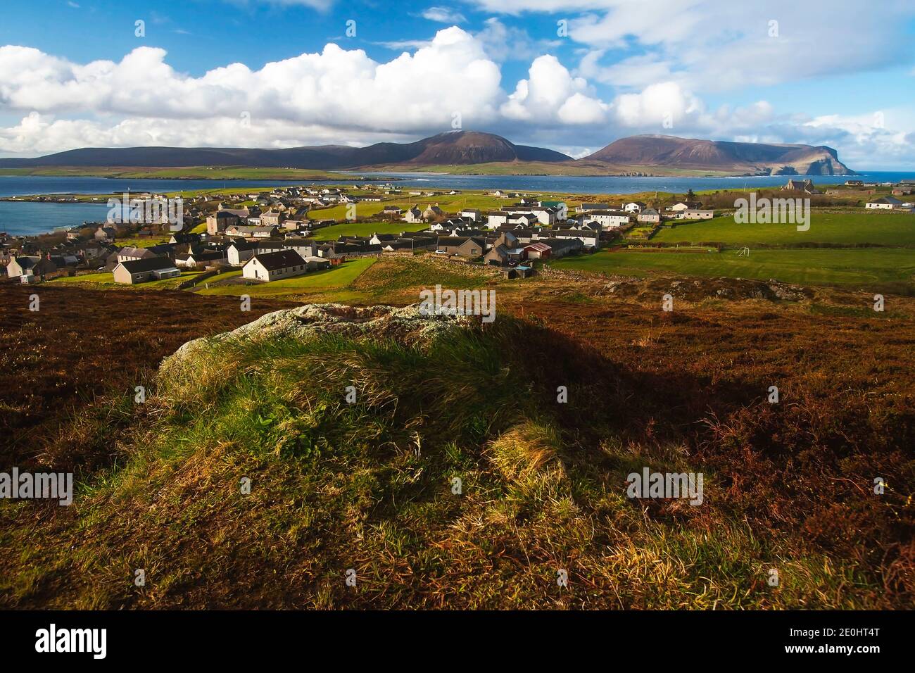 View of Orcadian town Stromness from top of the hill with coastline in the background Stock Photo