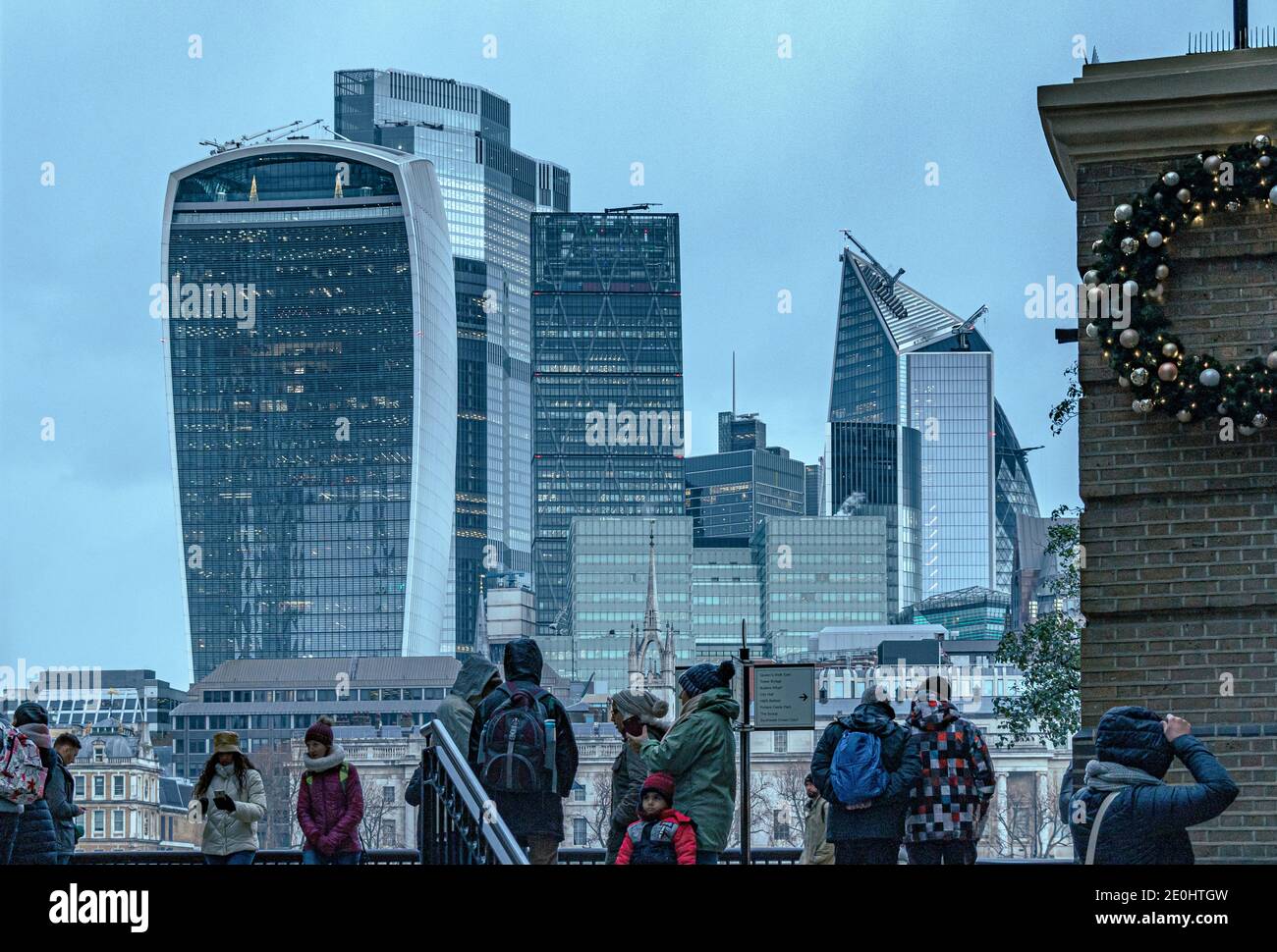People at the entrance to Hays Galleria with the City of London with the Walkie Talkie and other skyscrapers in the background , City of London,UK Stock Photo