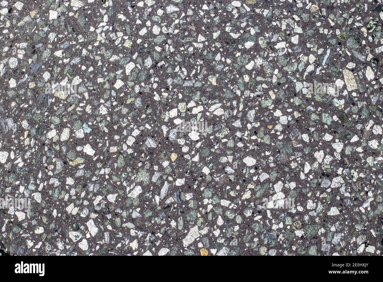 gray asphalt interspersed with fine gravel. Road surface texture. Background for text Stock Photo
