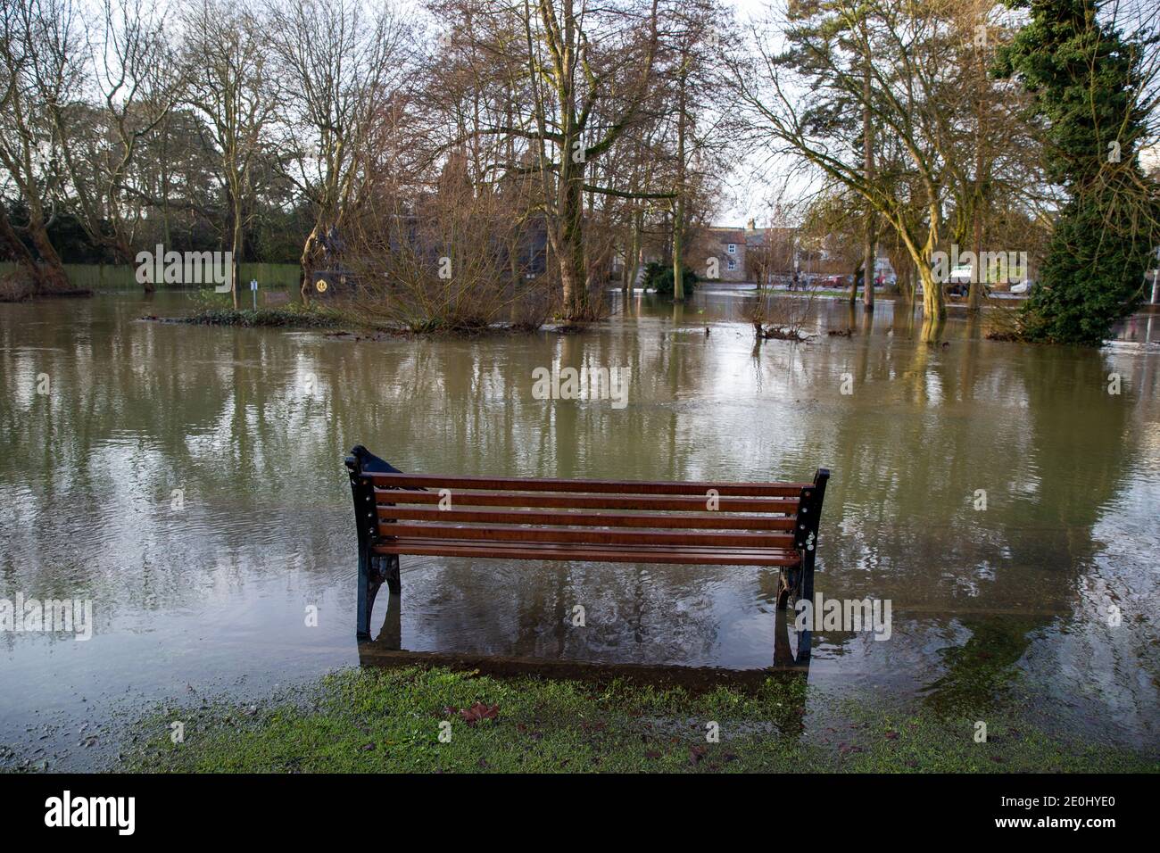 Picture dated December 28th shows Thetford town centre in Norfolk which has been flooded for the first time in 50 years after the River Thet burst its banks.One person who did not panic was the statue of Captain Mainwaring from DadÕs Army after the water rose up around the bench he is sitting on.The TV series was filmed in the area in the 1960Õs and 70Õs.  Snow and ice warnings are in place for much of the UK heading into the bank holiday, including as far south as London, as vast swathes of the country are braced for a cold snap in the aftermath of Storm Bella.  It comes as around 100 flood w Stock Photo