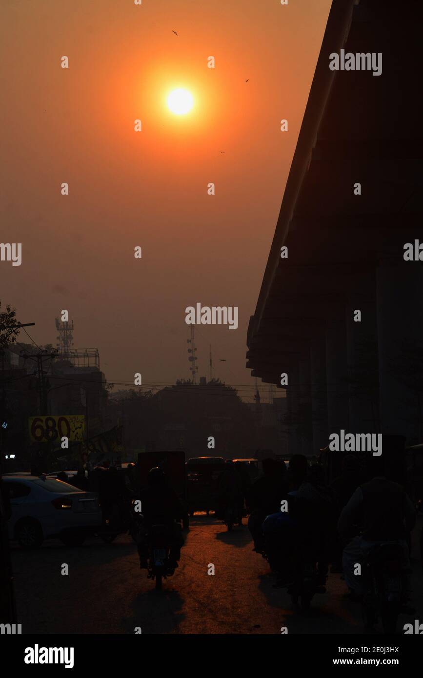 An attractive stunning eye catching view of the first Sun Rise of Year 2021 in provincial Capital city of  Lahore Stock Photo