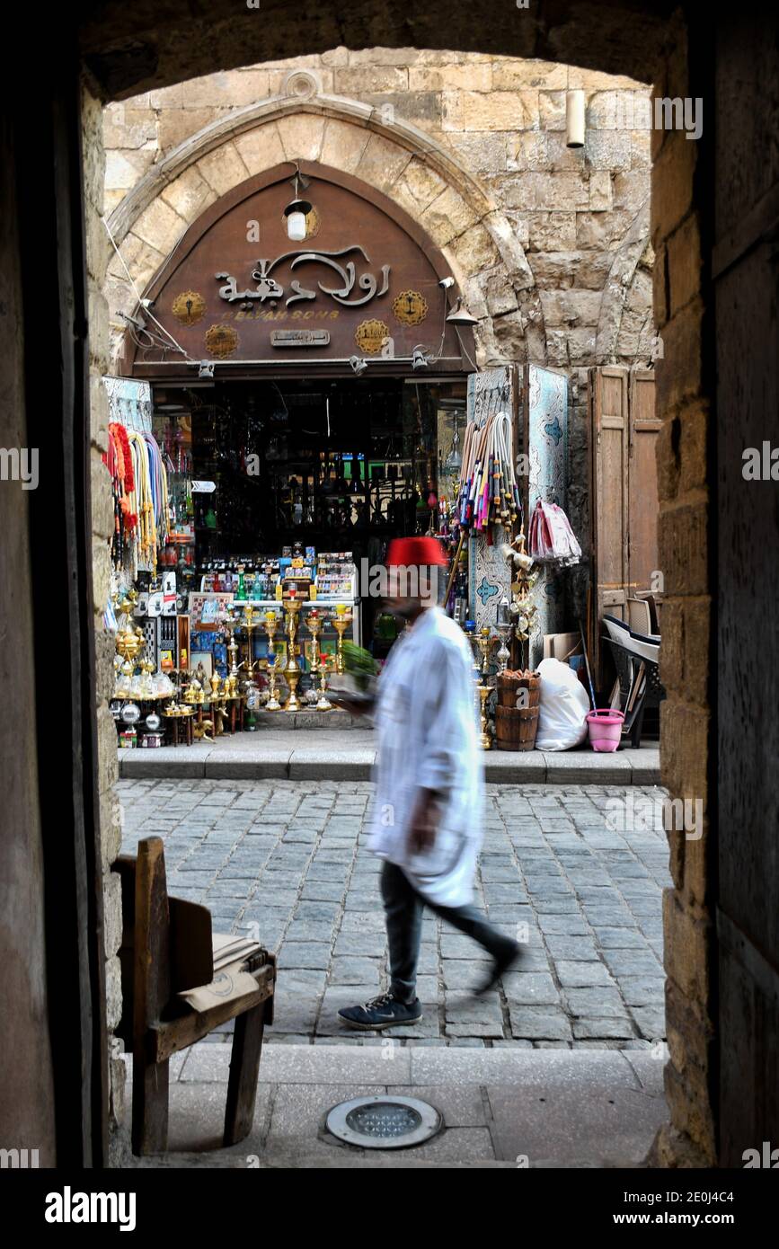December 30, 2020: Cairo, Egypt. 30 December 2020. Images of daily life in the El-Moez street in Old Cairo. Al-Moez street is a busy street in an Old Cairo neighbourhood with shops, street vendors, and old cafes alongside medieval buildings and mosques. The picturesque medieval Islamic architecture is a glimpse of the historic legacy and treasures of Old Cairo that enriches the lively atmosphere of the street. Life is buzzing in the El-Moez street on the penultimate day of the year, despite a sudden spike in virus infections in recent weeks in Egypt (Credit Image: © Nermin Ashraf/IMAGESLIVE vi Stock Photo