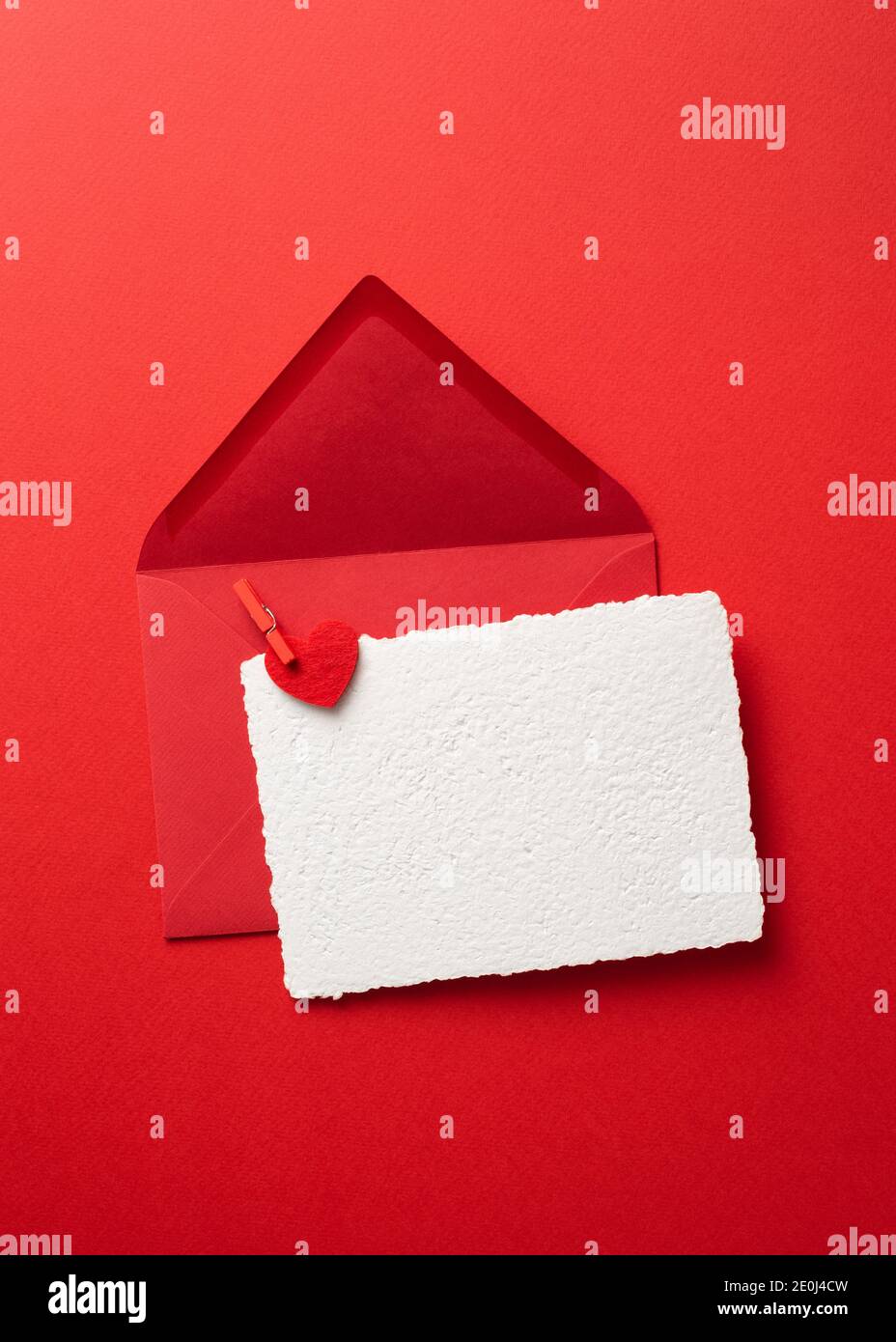 Valentines Day greeting card mockup in envelope on a red background ...
