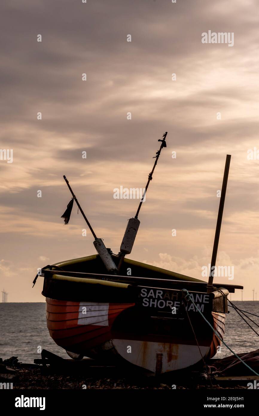 A fishing boat on the beach at Worthing Stock Photo - Alamy