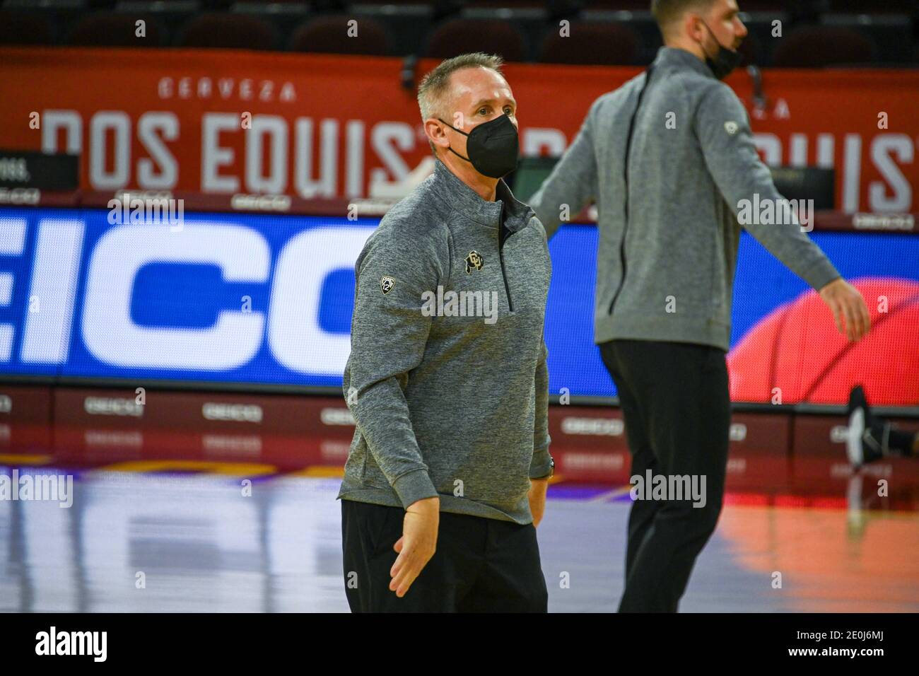 Colorado Buffaloes assistant coach Bill Grier assists players before an NCAA basketball game against the Southern California Trojans, Thursday, Dec. 3 Stock Photo