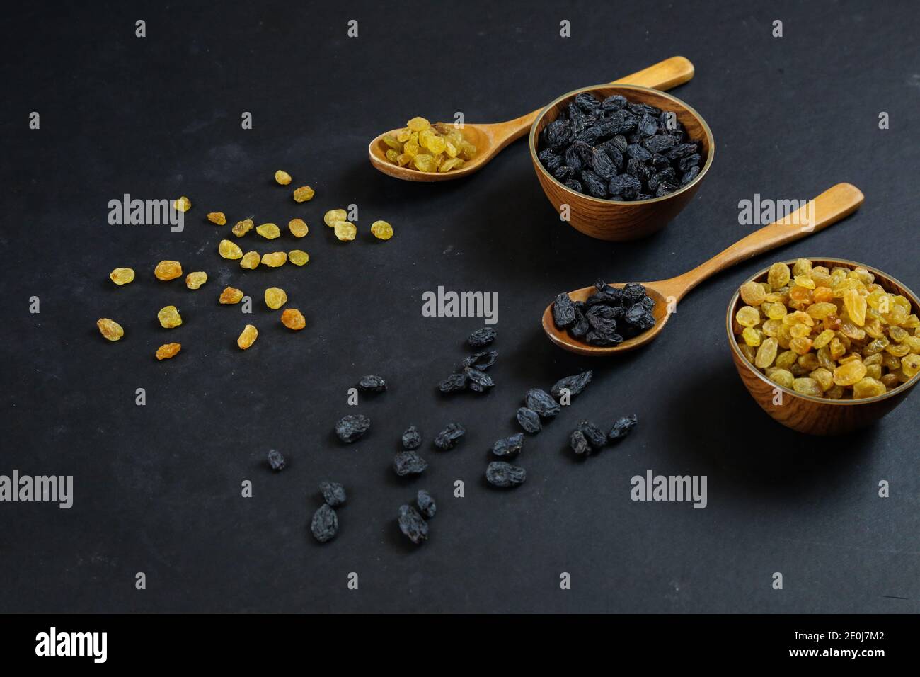 Dried raisins on black background Stock Photo