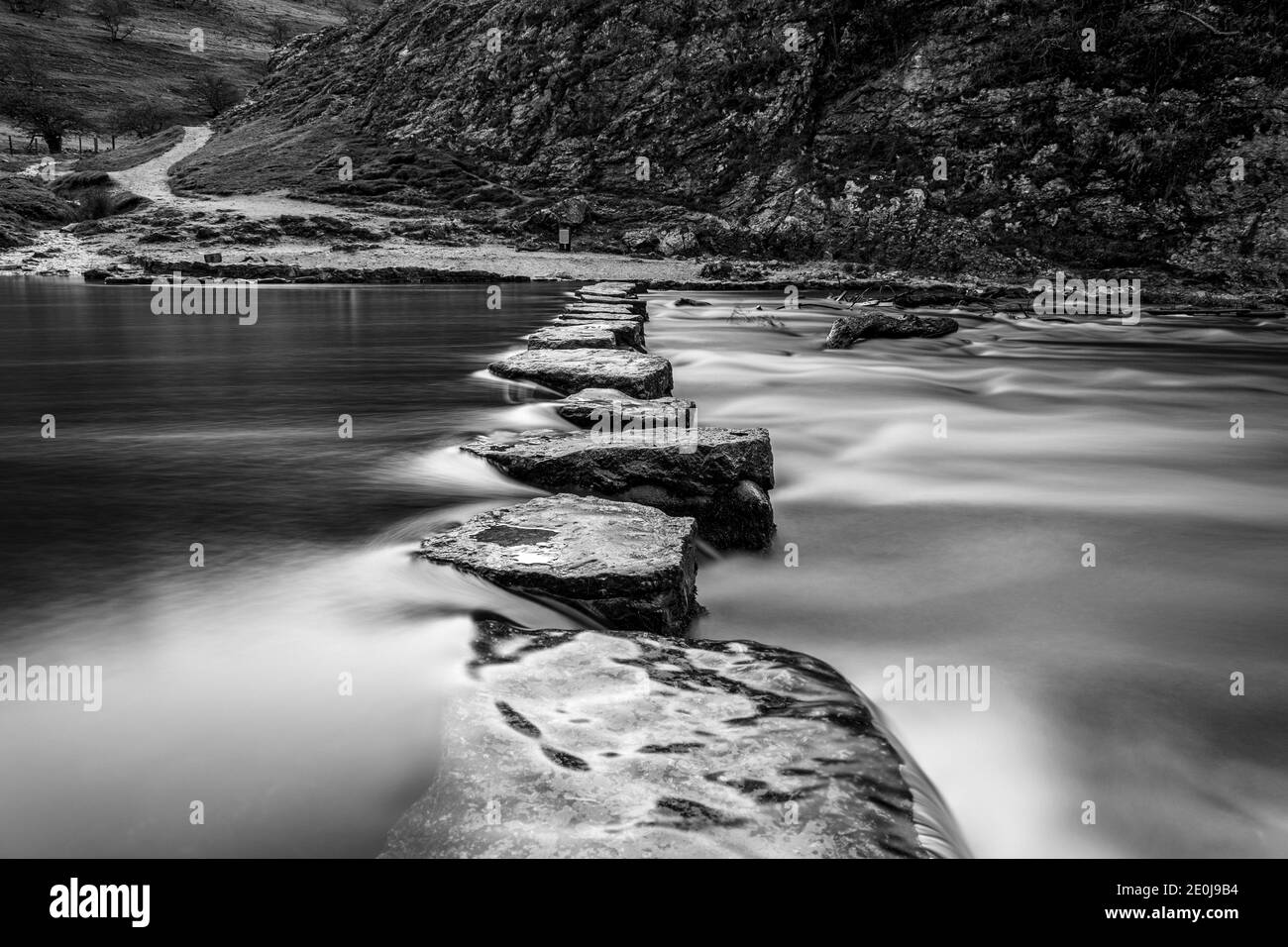 Dovedale valley stepping stones very early morning long exposure Stock Photo