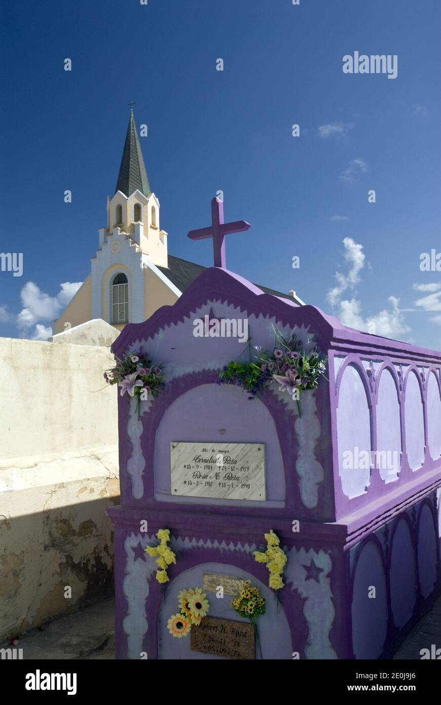 Colorful crypts in the cemetery next to the historic and colorful St. Anna's Catholic Church, Noord, Aruba. Stock Photo