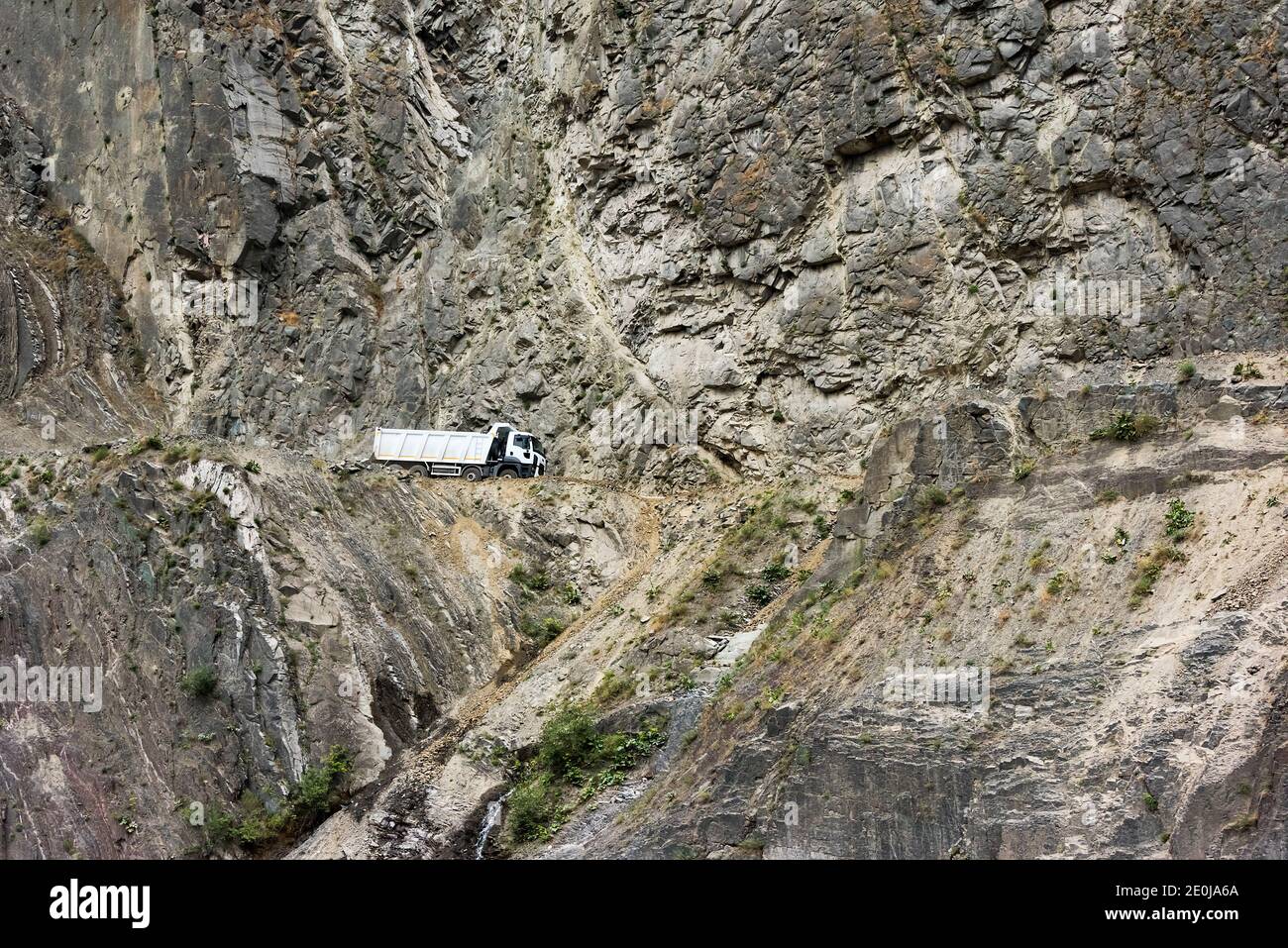 Road built on the steep cliff of the southern slopes of Greater Caucasus to Lahij village, Ismailli region, Azerbaijan Stock Photo
