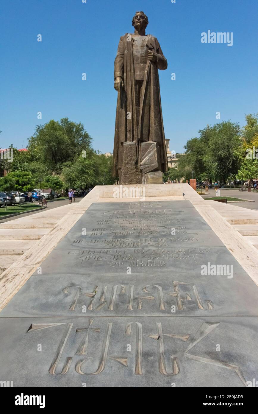 Statue of Garegin Nzhdeh (statesman and military strategist) with a pedestal made of travertine and basalt combination and the popular thoughts of Nzh Stock Photo