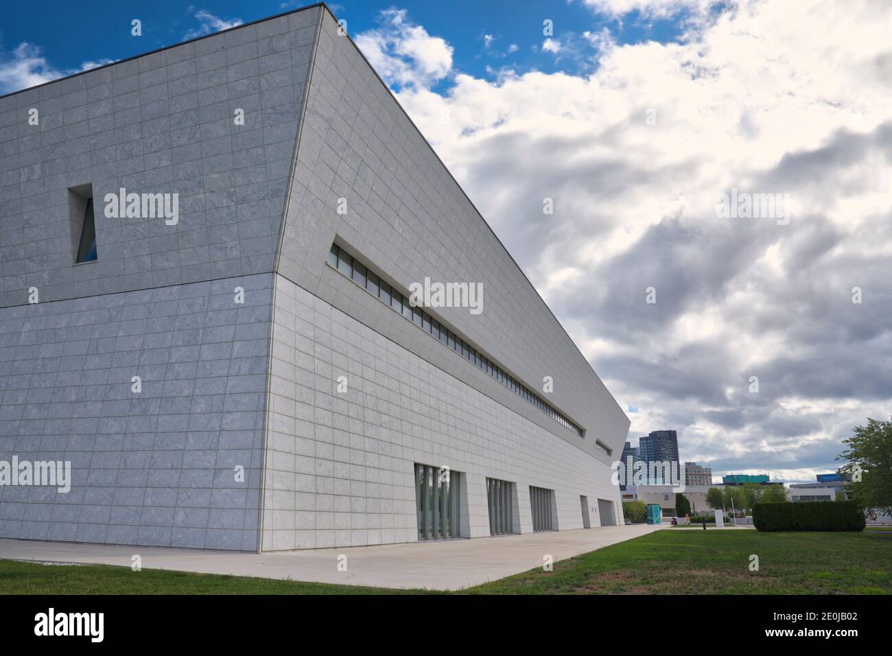The exterior of the modern building with a cloudy sky Stock Photo - Alamy