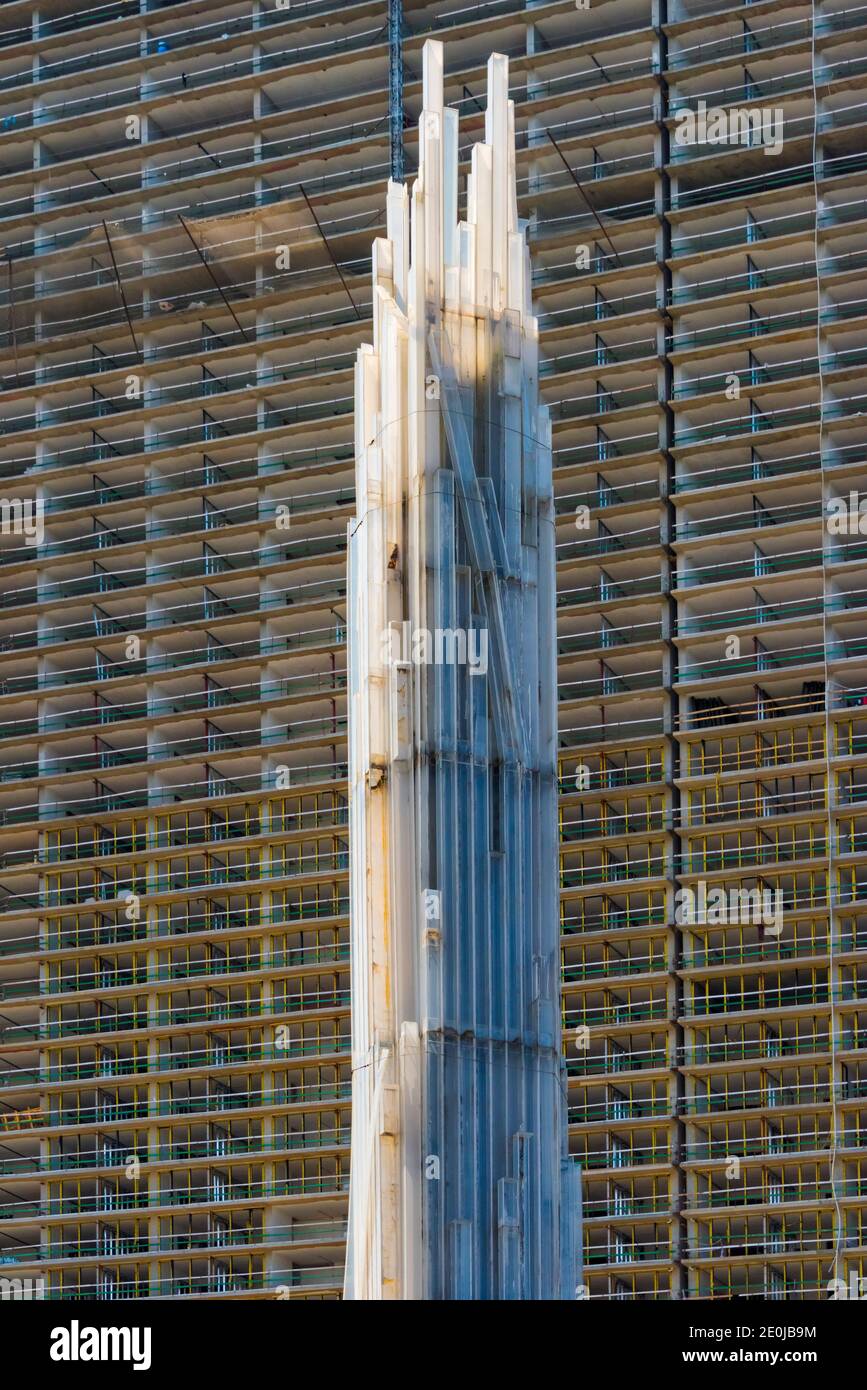 White tower statue in front of high rise, Batumi, Georgia Stock Photo