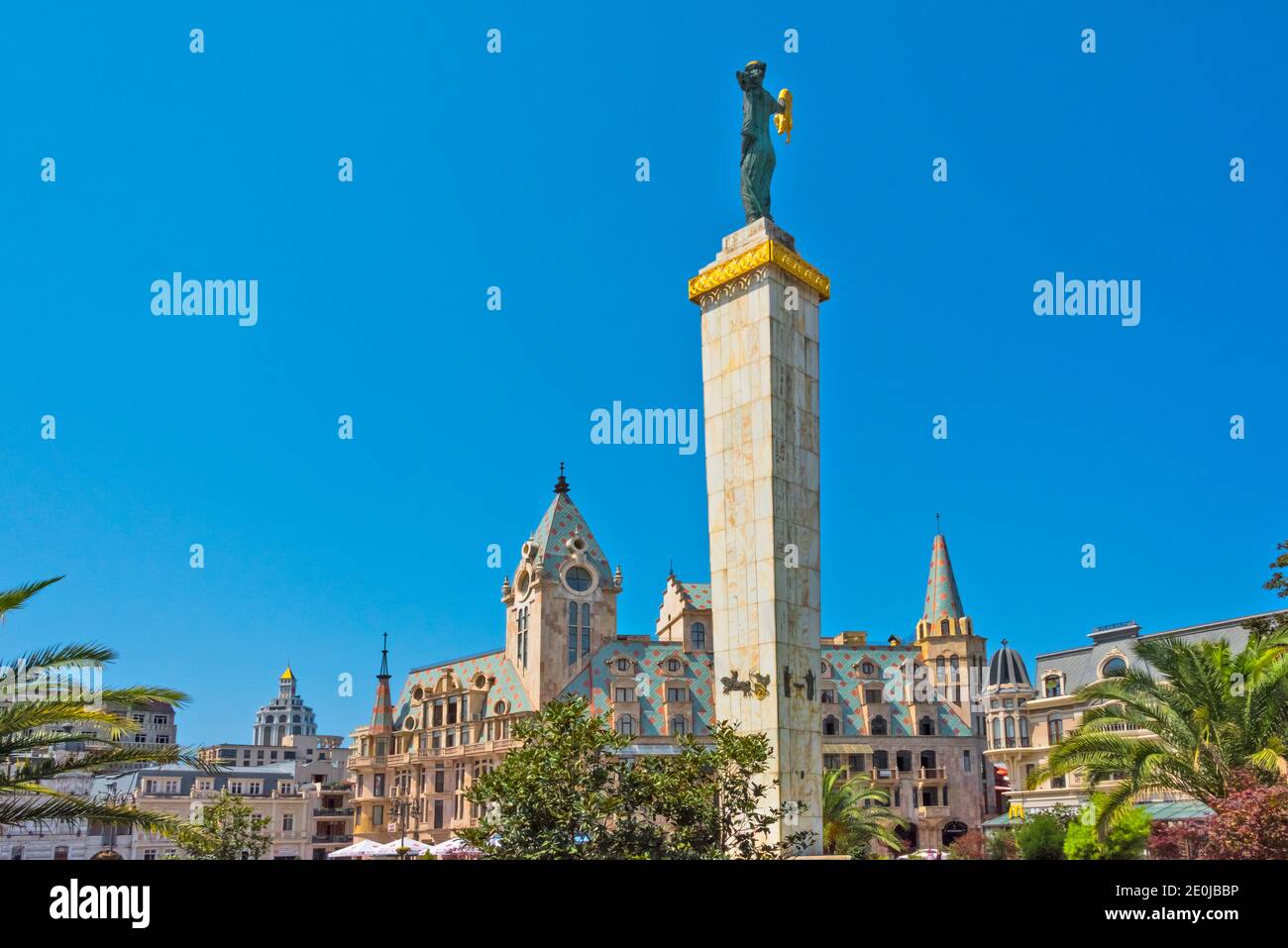 Statue of Medea holding golden fleece and beautiful buildings in Europe Square, Batumi, Georgia Stock Photo