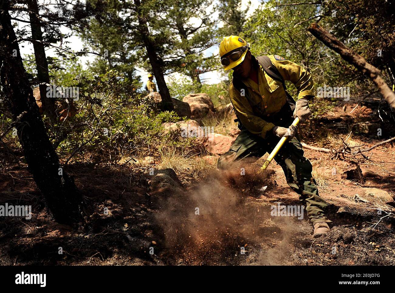 Vandenberg Air Force Base Hot Shot fire fighter Lupe Covarrubias cuts a fire line on June 28, 2012 in the Mount Saint Francois area of Colorado Springs, Co. while helping to battle several fires in Waldo Canyon. The Waldo Canyon fire has grown to 18,500 acres and burned over 300 homes. Currently, more than 90 firefighters from the Academy, along with assets from Air Force Space Command; F.E. Warren Air Force Base, Wyo.; Fort Carson, Colo.; and the local community continue to fight the Waldo Canyon fire. Photo by U.S. Air Force via ABACAPRESS.COM Stock Photo