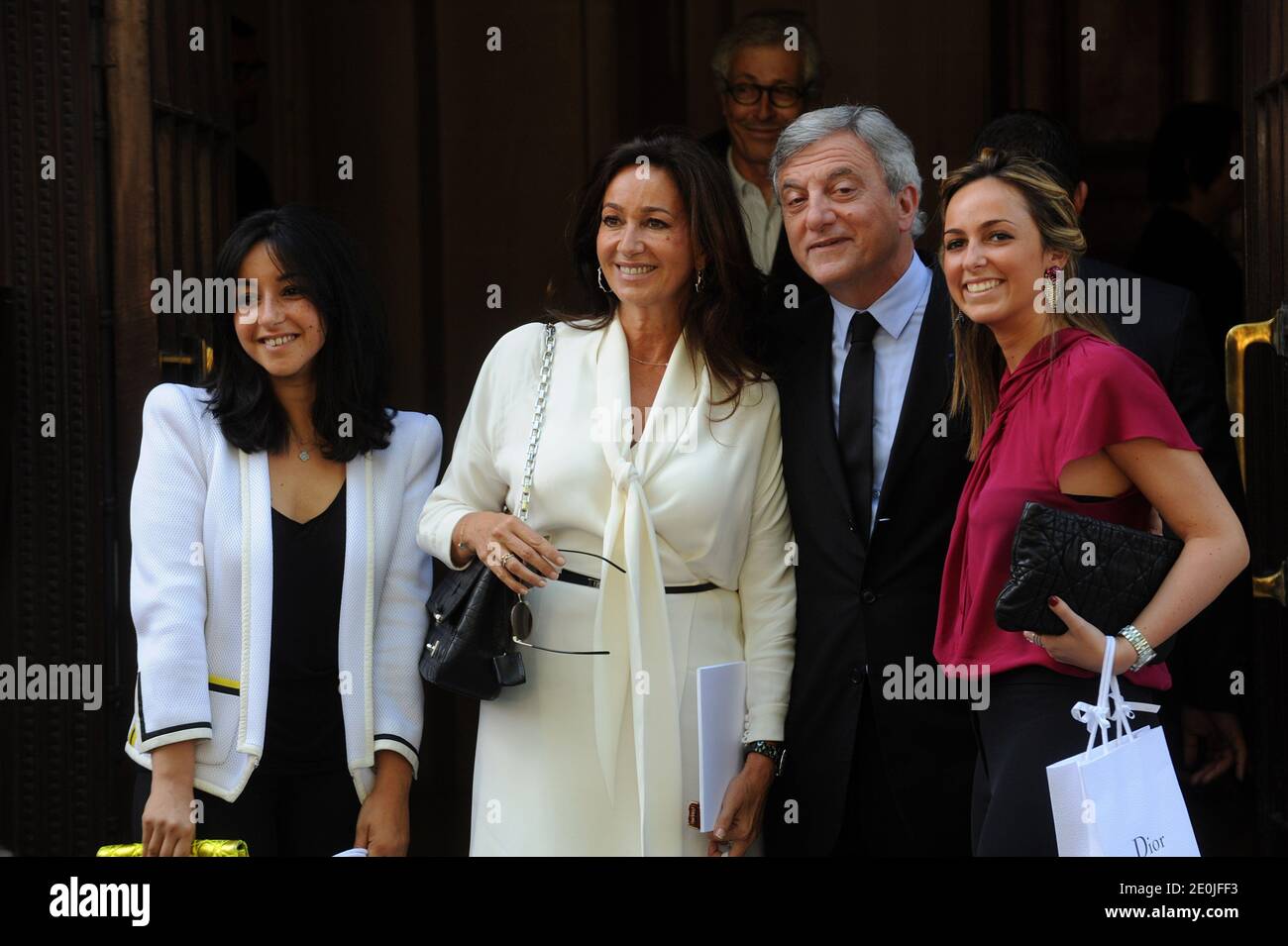 Bernard Arnault's daughter Delphine (R) and French fashion stylist Pierre  Cardin pose beside items on display after a press conference at the  occasion of Christian Dior's centenary at the headquarters of Christian