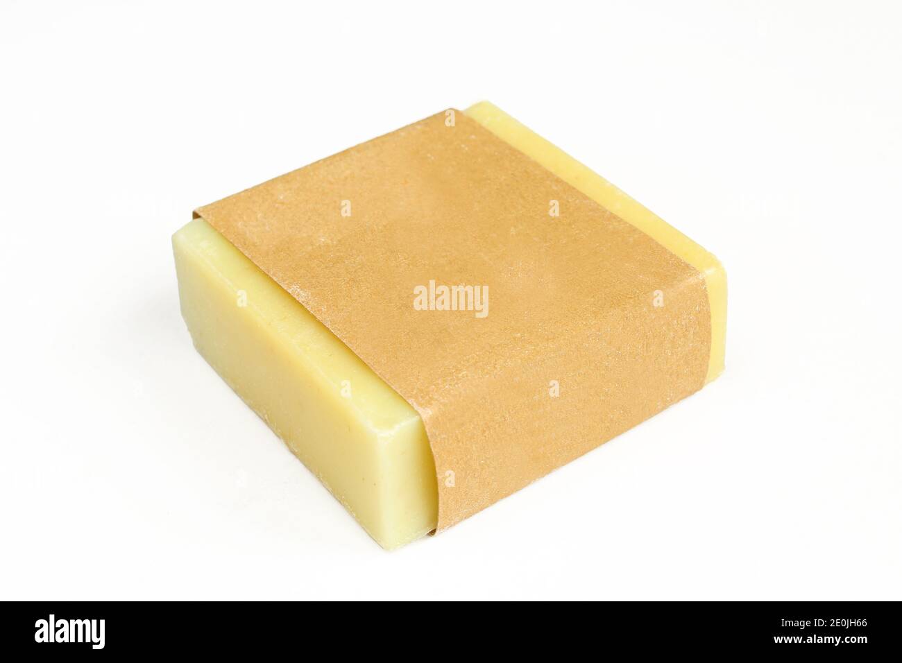 Yellow herbal soap isolated on white background. Homemade soap wrapped
