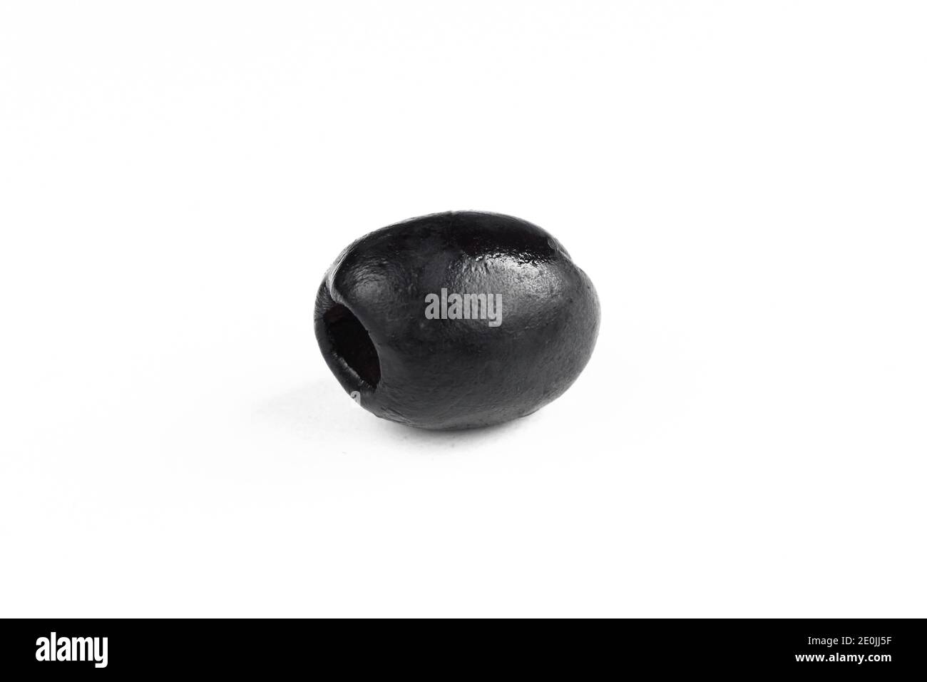 Single black olive isolated on white background. One dark fruit closeup Stock Photo Alamy