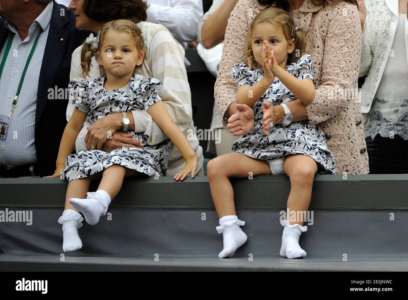 Switzerland's Roger Federer's wife Mirka Vavrinec with daughters Myla and Charlene in the Men Final during day thirteen of the 2012 Wimbledon Championships at the All England Lawn Tennis Club, Wimbledon in London, UK on July 8, 2012. Photo by Corinne Dubreuikl/ABACAPRESS.COM Stock Photo