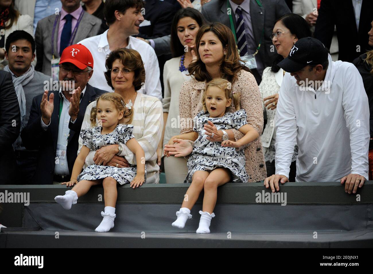 Switzerland's Roger Federer's wife Mirka Vavrinec with daughters Myla and Charlene in the Men Final during day thirteen of the 2012 Wimbledon Championships at the All England Lawn Tennis Club, Wimbledon in London, UK on July 8, 2012. Photo by Corinne Dubreuikl/ABACAPRESS.COM Stock Photo