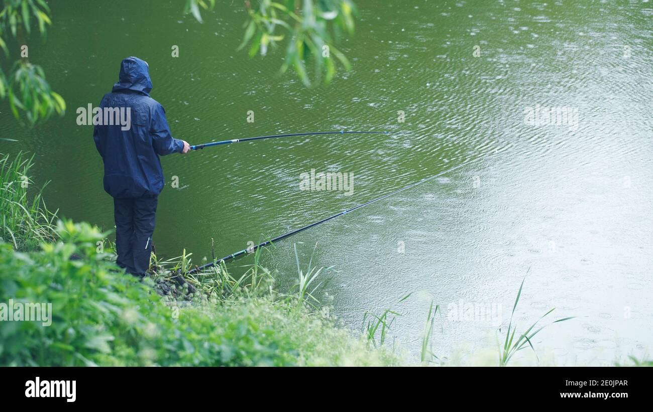 Hand holding fishing pole hi-res stock photography and images - Alamy