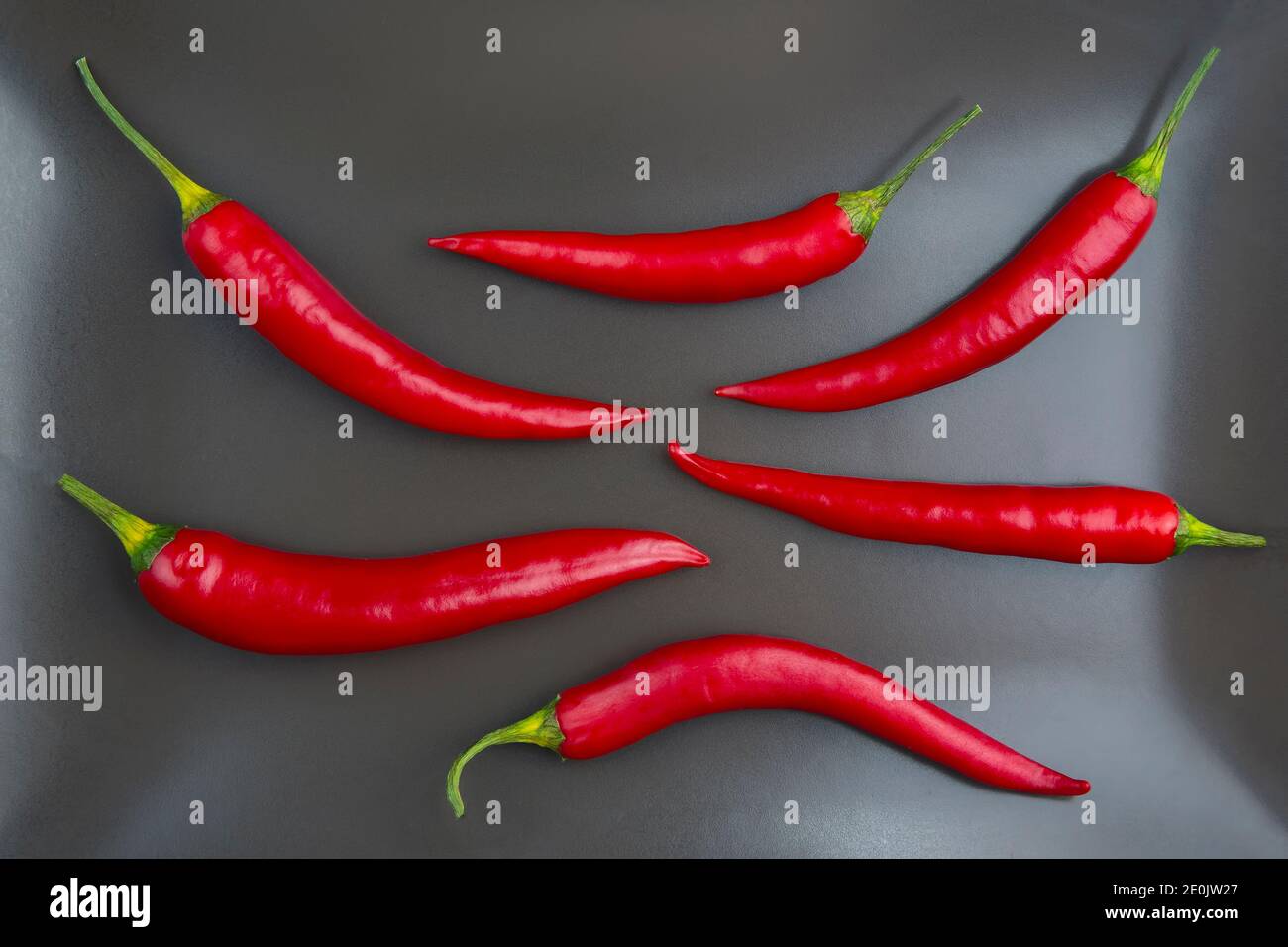 Red hot pepper close up on a grey plate Healthy vegetable food and
