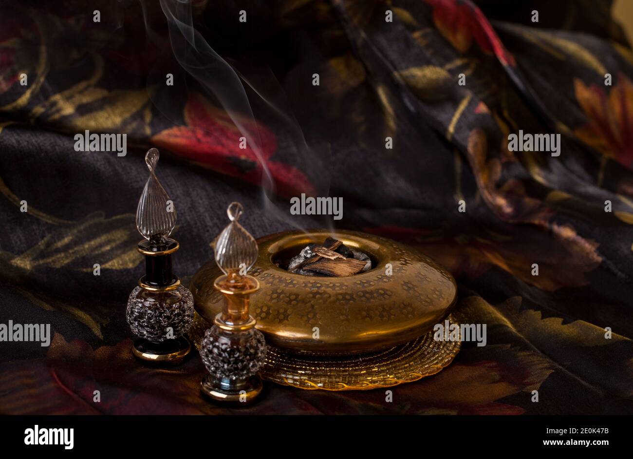 Agarwood, also called aloeswood, essential oil and burning incense chips Stock Photo