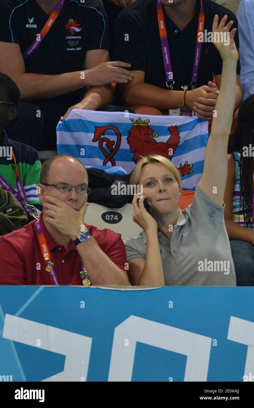 Prince Albert II of Monaco and Princess Charlene of Monaco following the south African swimming team inside the aquatic center during the London Olympic games in London, UK on July 31, 2012. Photo by Guibbaud-Gouhier-JMP/ABACAUSA.COM Stock Photo