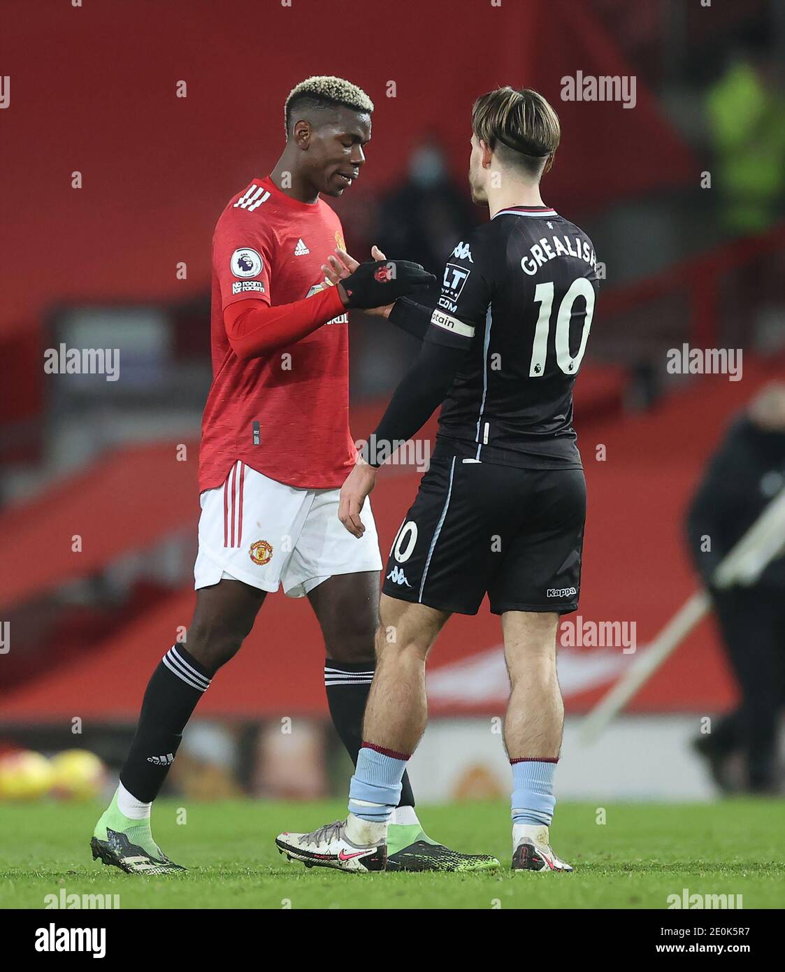 Manchester United S Paul Pogba Left Shakes Hands With Aston Villa S Jack Grealish After The Premier League Match At Old Trafford Manchester Stock Photo Alamy