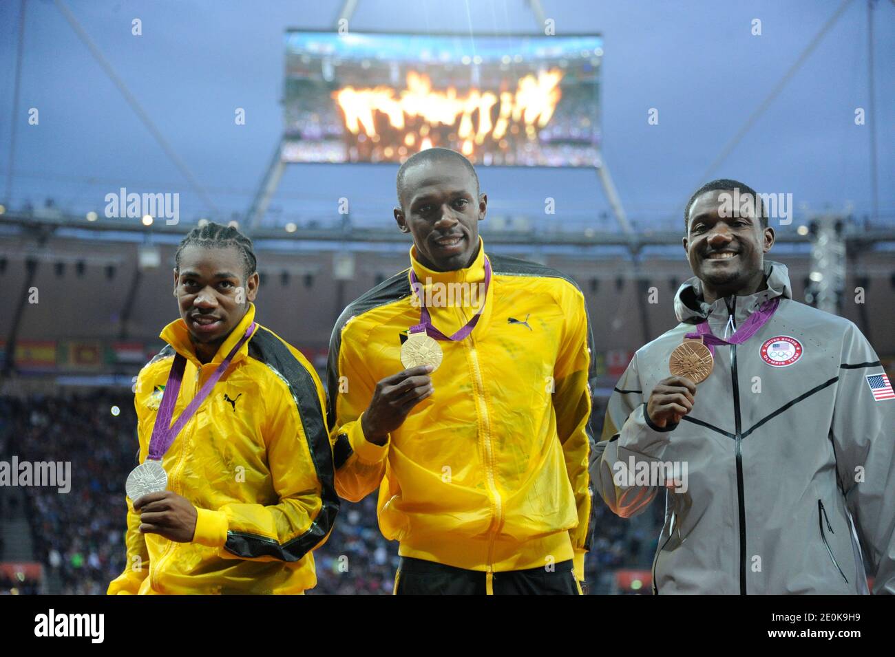 Gold medalist Usain Bolt of Jamaica, center, silver medalist Yohan Blake of Jamaica, left, and Justin Gatlin of the United States display their Olympic medals for the men's 100m sprint during the medal ceremony at Olympic Stadium in London, UK, Monday, August 6, 2012. Photo by Henri Swarc/ABACAPRESS.COM Stock Photo