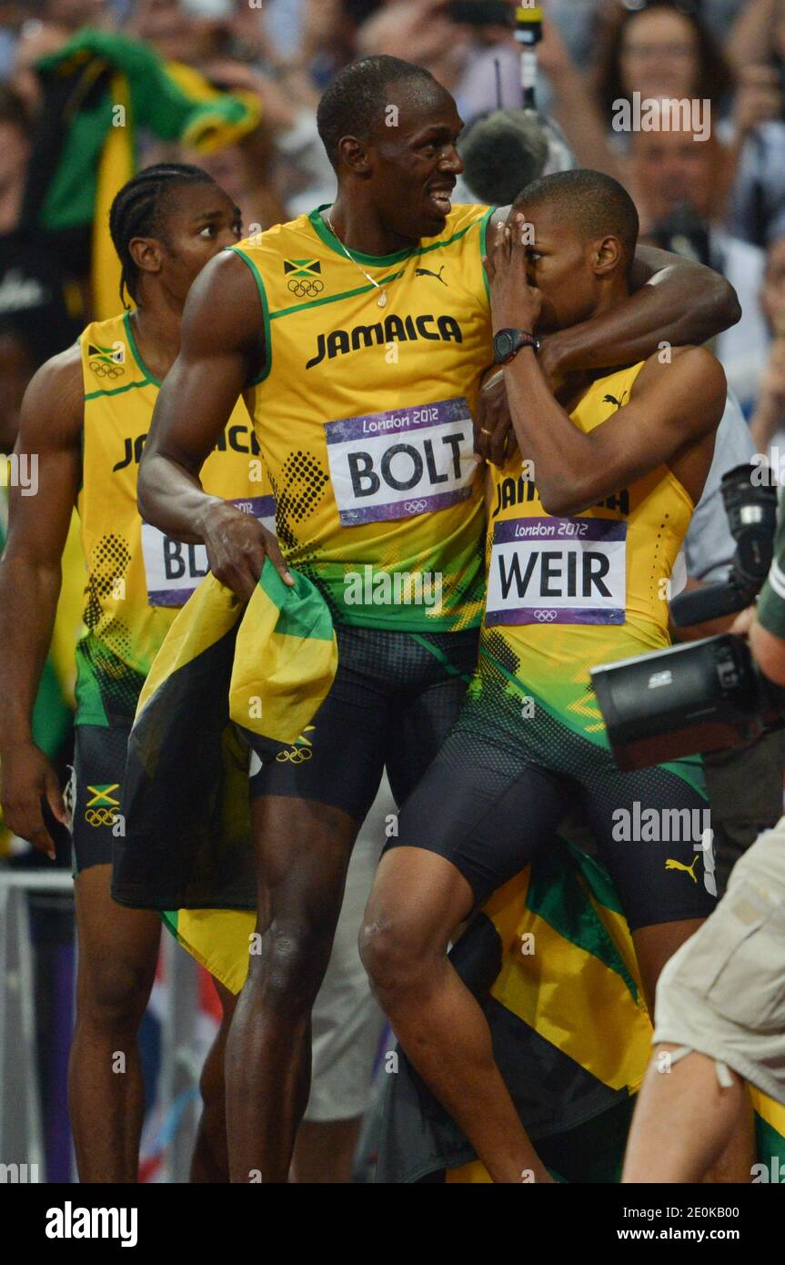 Jamaica's Gold medalist Usain Bolt celebrates with Jamaica's silver  medalist Yohan Blake and Jamaica's bronze medalist Warren Weir after the  men's 200m final at the Olympic Stadium, at the London 2012 Olympics, image size:863x1390
