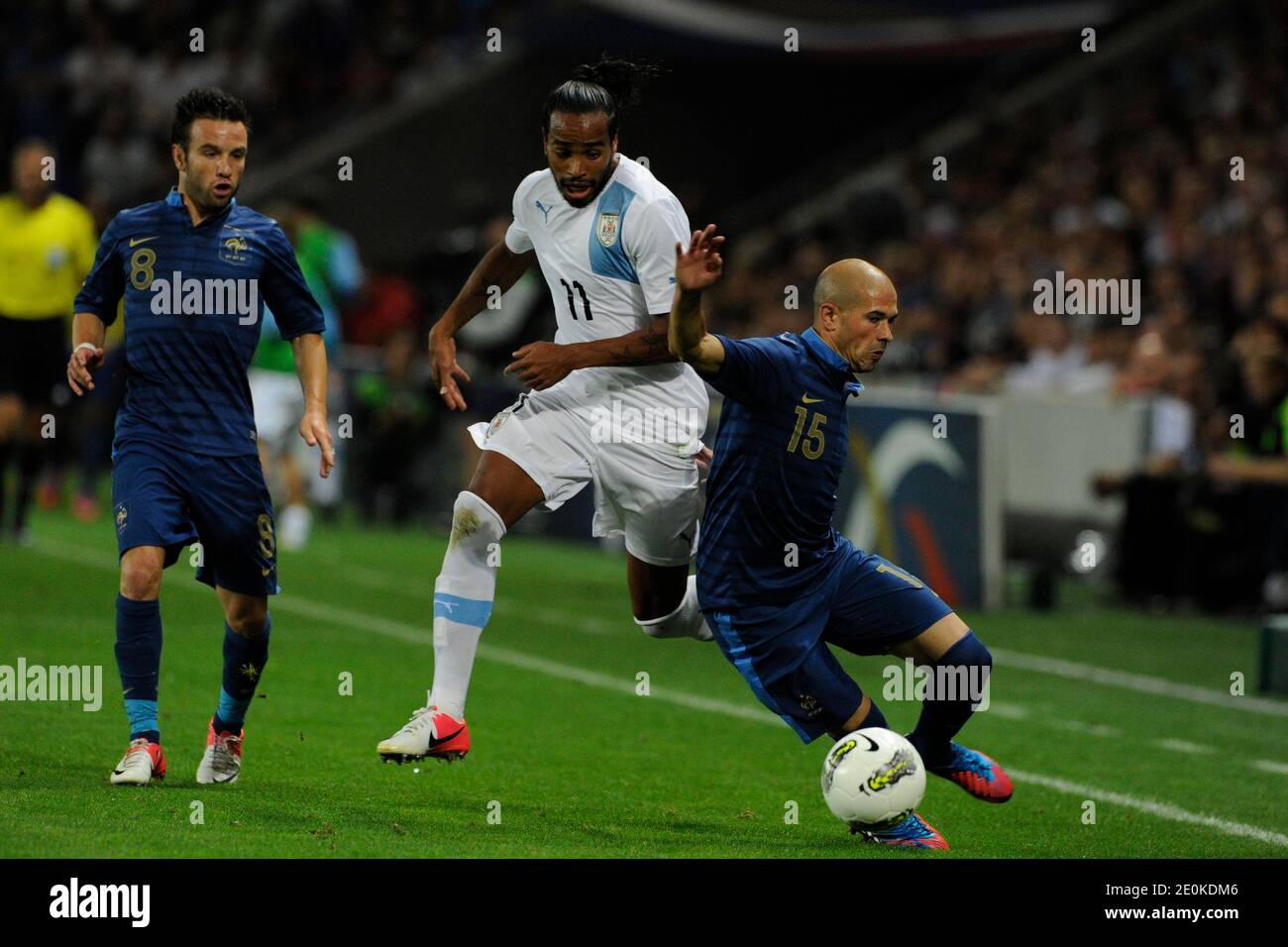 France's Christophe Jallet and Mathieu Valbuena battling Uruguay's Alvaro Pereira during a friendly soccer match, France vs Uruguay in Le Havre, France, on August 15th, 2012. France and Uruguay drew 0-0. Photo by Henri Szwarc/ABACAPRESS.COM Stock Photo