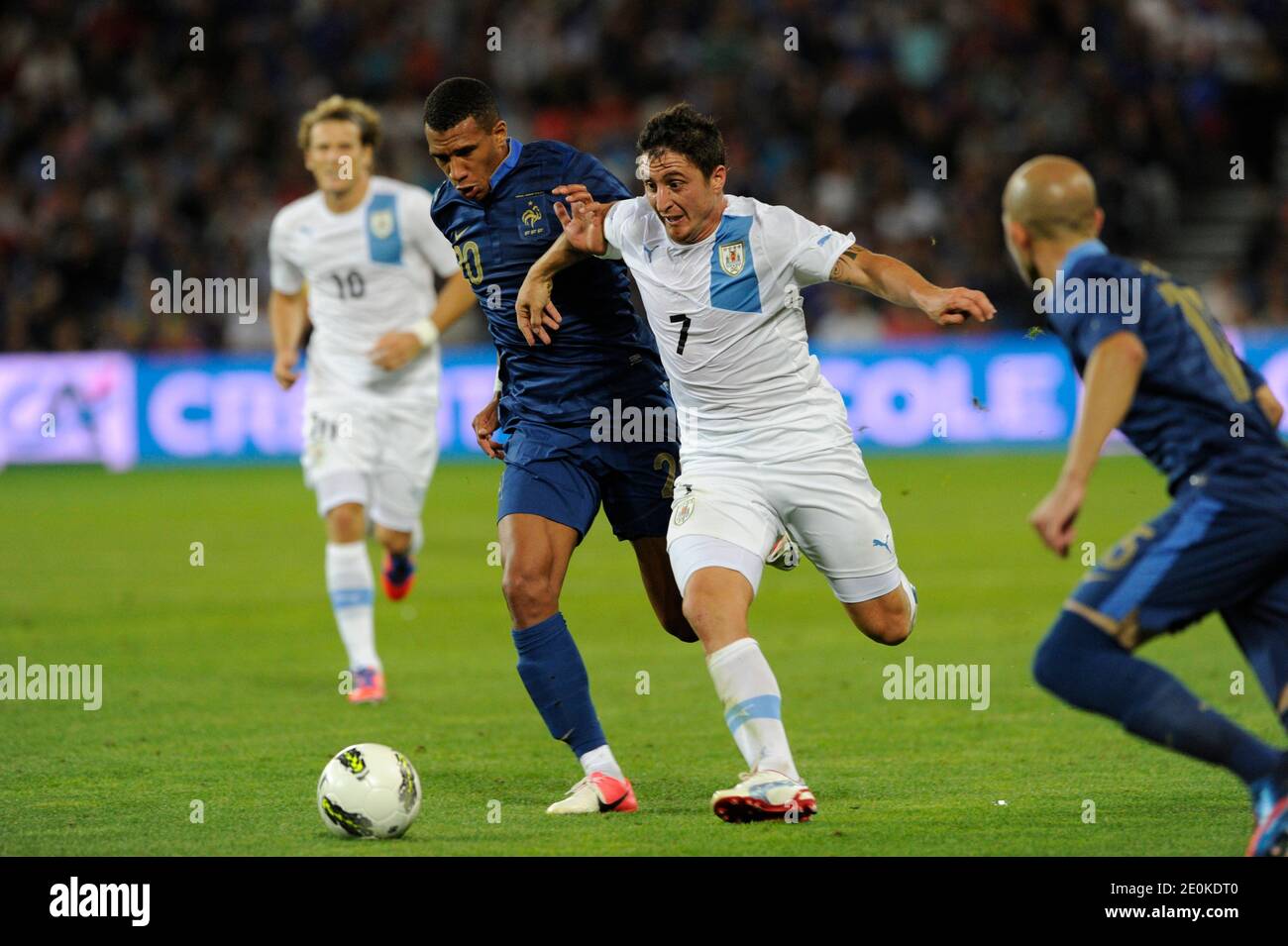 France's Etienne Capoue battling Uruguay's Cristian Rodríguez during a friendly soccer match, France vs Uruguay in Le Havre, France, on August 15th, 2012. France and Uruguay drew 0-0. Photo by Henri Szwarc/ABACAPRESS.COM Stock Photo