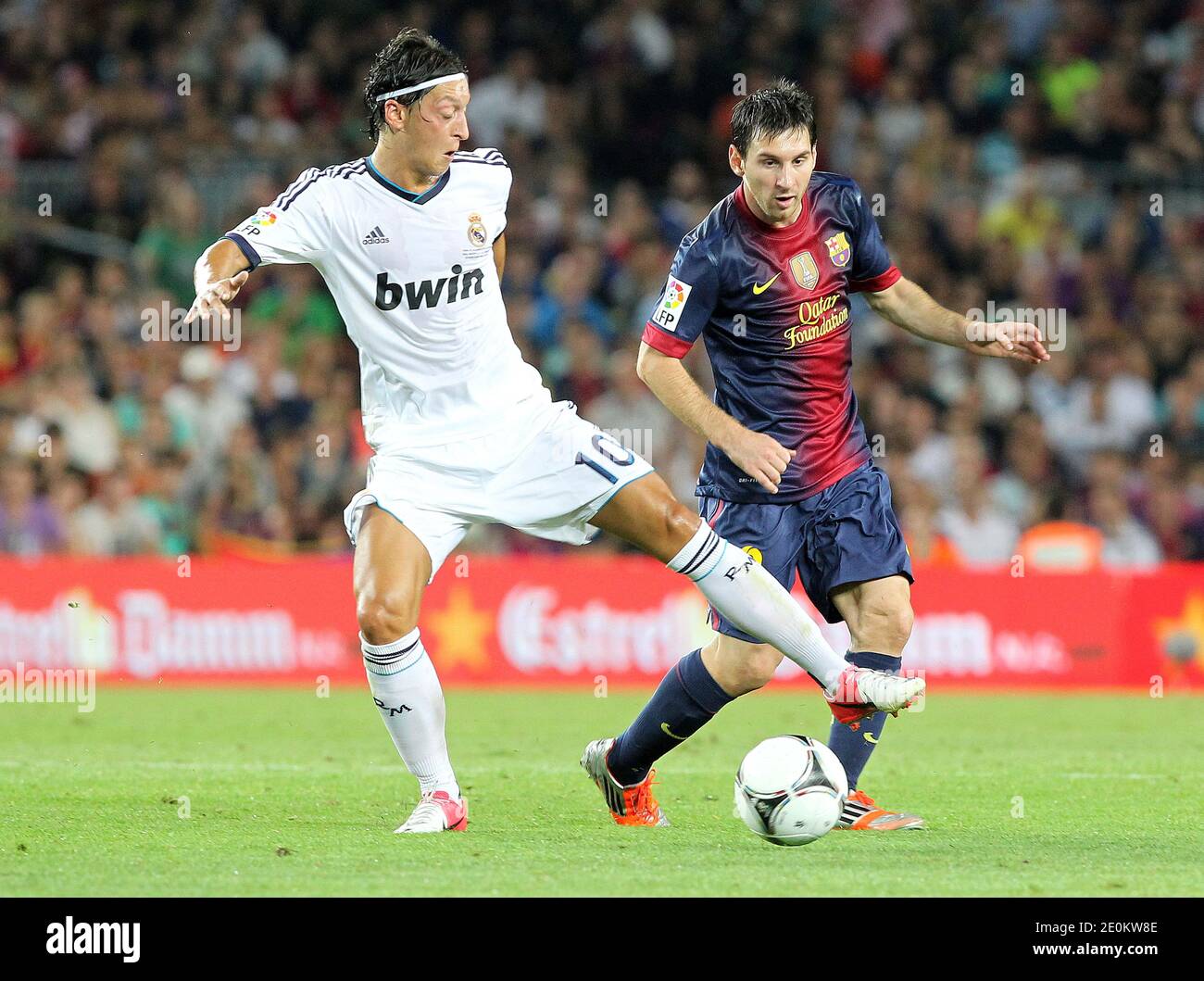 Real Madrid's Mesut Ozil and Barlona's Lionel Messi during the Spanish Supercup first-leg football match FC Barcelona Vs Real Madrid CF at the Camp Nou stadium in Barcelona, Spain on August 23, 2012. Photo by Giuliano  Bevilacqua/ABACAPRESS.COM Stock Photo