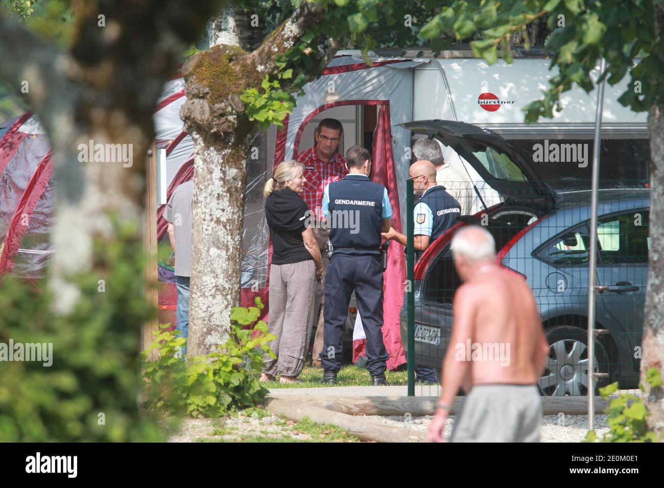 Police investigate the caravan of the shooting victims at Le Solitaire du Lac camp site in Saint-Jorioz, French Alps on September 6, 2012. One man, named as Saad al-Hilli from Surrey, and an elderly woman were found dead in a British-registered BMW. A French cyclist, found close to the scene, was also killed. A second woman was also killed. A girl, four, hid in the car for eight hours before being found by police. Photo by Vincent Dargent/ABACAPRESS.COM Stock Photo