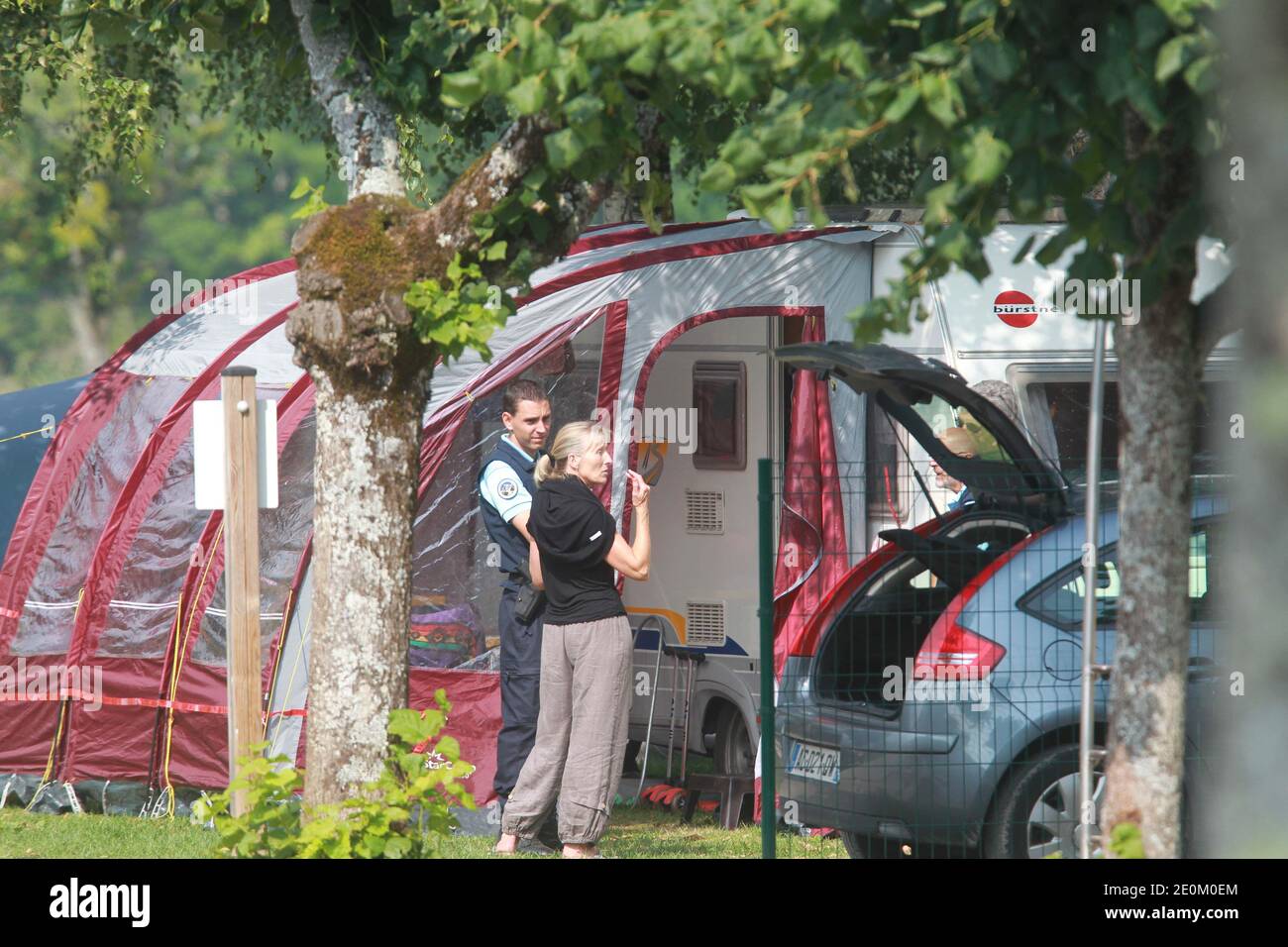 Police investigate the caravan of the shooting victims at Le Solitaire du Lac camp site in Saint-Jorioz, French Alps on September 6, 2012. One man, named as Saad al-Hilli from Surrey, and an elderly woman were found dead in a British-registered BMW. A French cyclist, found close to the scene, was also killed. A second woman was also killed. A girl, four, hid in the car for eight hours before being found by police. Photo by Vincent Dargent/ABACAPRESS.COM Stock Photo