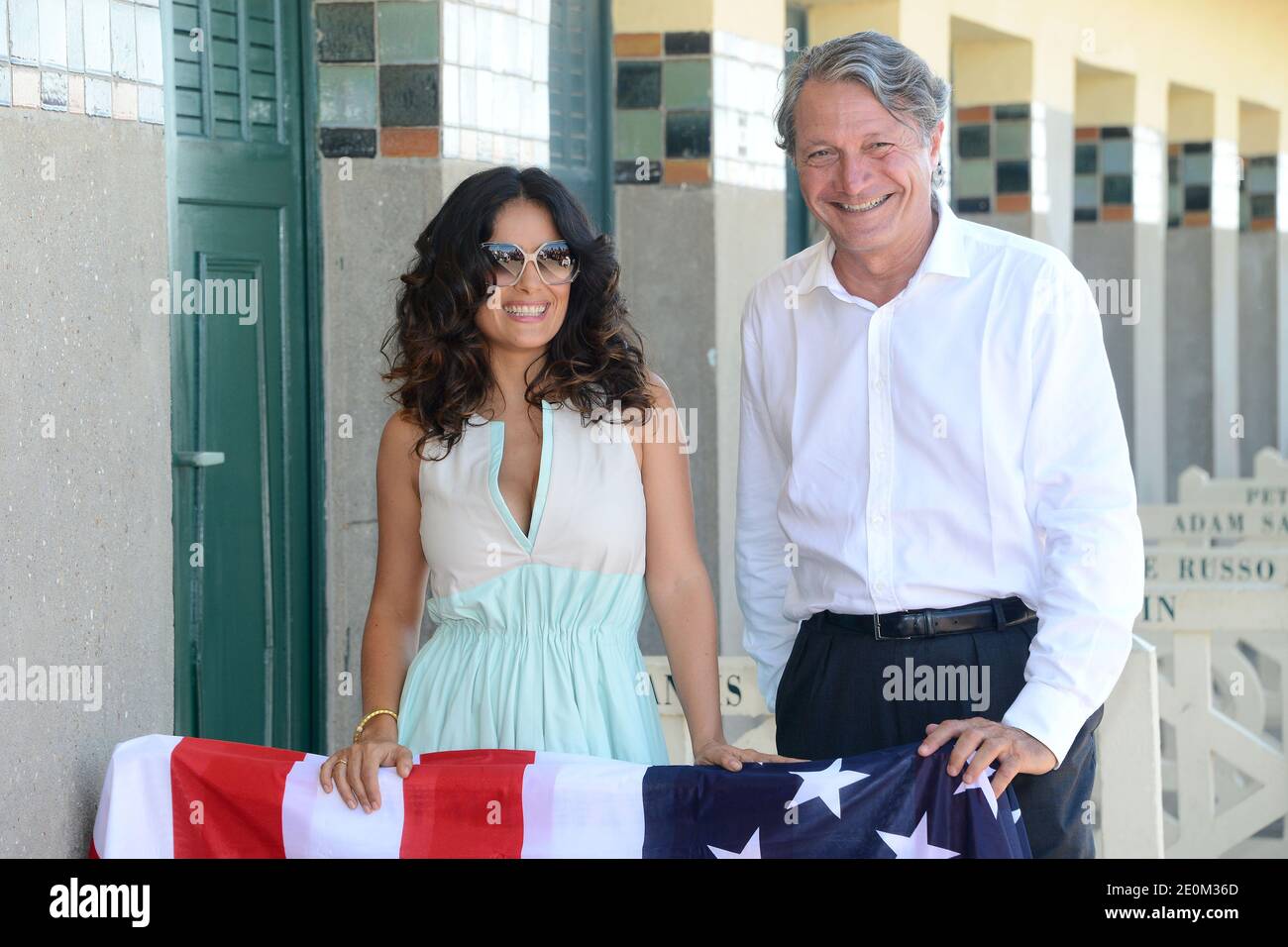 Salma Hayek poses along with Deauville Mayor Philippe Augier next to the beach closet dedicated to her on the Promenade des Planches as part of a special tribute for her lifetime achievement, during the 38th Deauville American Film Festival in Deauville, France on September 8, 2012. Photo by Nicolas Briquet/ABACAPRESS.COM Stock Photo