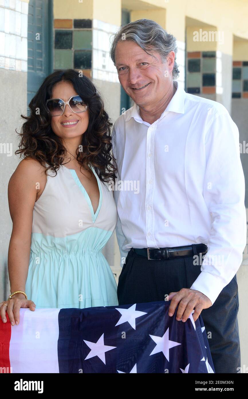 Salma Hayek poses along with Deauville Mayor Philippe Augier next to the beach closet dedicated to her on the Promenade des Planches as part of a special tribute for her lifetime achievement, during the 38th Deauville American Film Festival in Deauville, France on September 8, 2012. Photo by Nicolas Briquet/ABACAPRESS.COM Stock Photo
