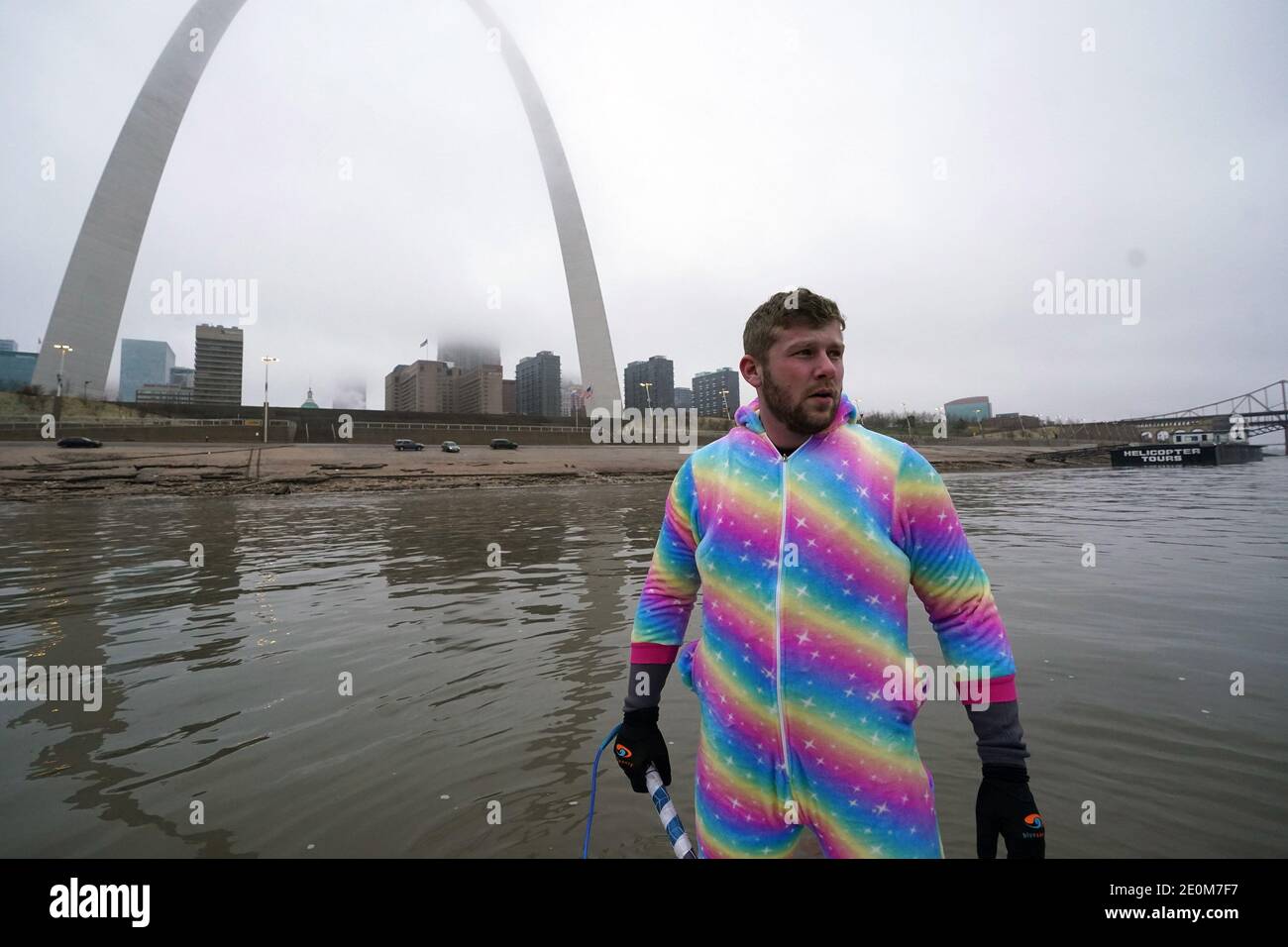 St. Louis, United States. 01st Jan, 2021. Water skier Brian Engelhard of Lake St. Louis, Missouri surveys the area before jumping into the Mississippi River to wake board on New Years Day, in St. Louis on Friday, January 1, 2021. Water skiers have shown up to ski on the Mississippi River for the past 36 years on New Years Day, raising money to teach those with developmental disabilities the art of water skiing. Photo by Bill Greenblatt/UPI Credit: UPI/Alamy Live News Stock Photo