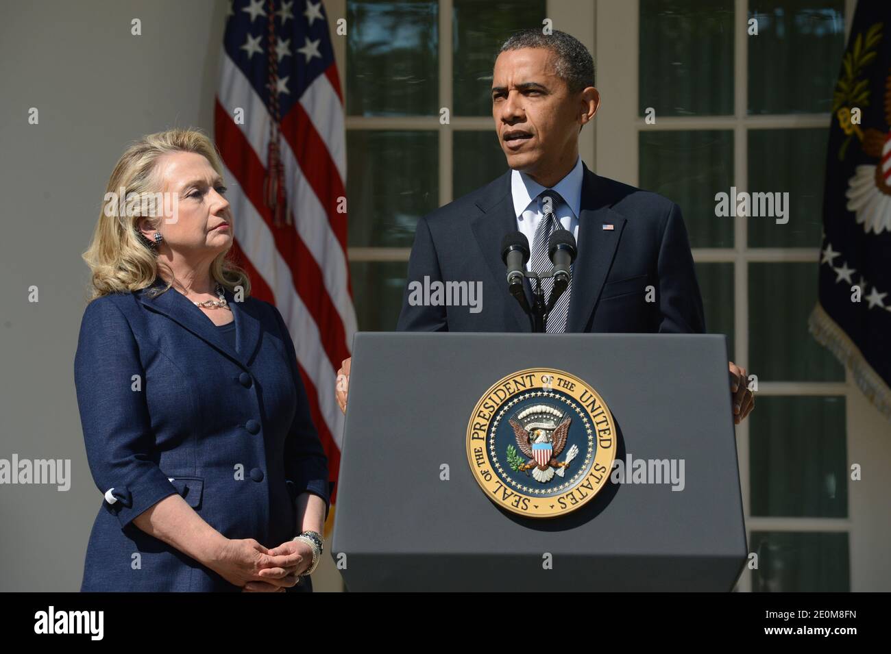 US President Barack Obama (R) delivers remarks beside US Secretary of State Hillary Clinton (L) on the killing of US ambassador to Libya, Christopher Stevens, and three embassy staff, in the Rose Garden of the White House in Washington DC, USA on September 12, 2012. Gunmen attacked the US consulate in Benghazi, killing US ambassador to Libya, Christopher Stevens, late 11 September 2012, while another assault took place on the US embassy in Cairo. Photo by Michael Reynolds/Pool/ABACAPRESS.COM Stock Photo