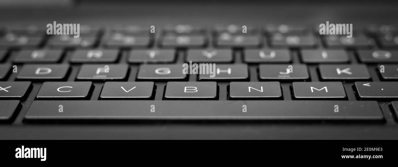 Keyboard close up from a black slim laptop Stock Photo